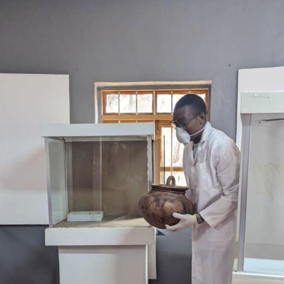 Danford Majogo taking care of displays during a restoration phase at the Maji Maji Museum, Songea.