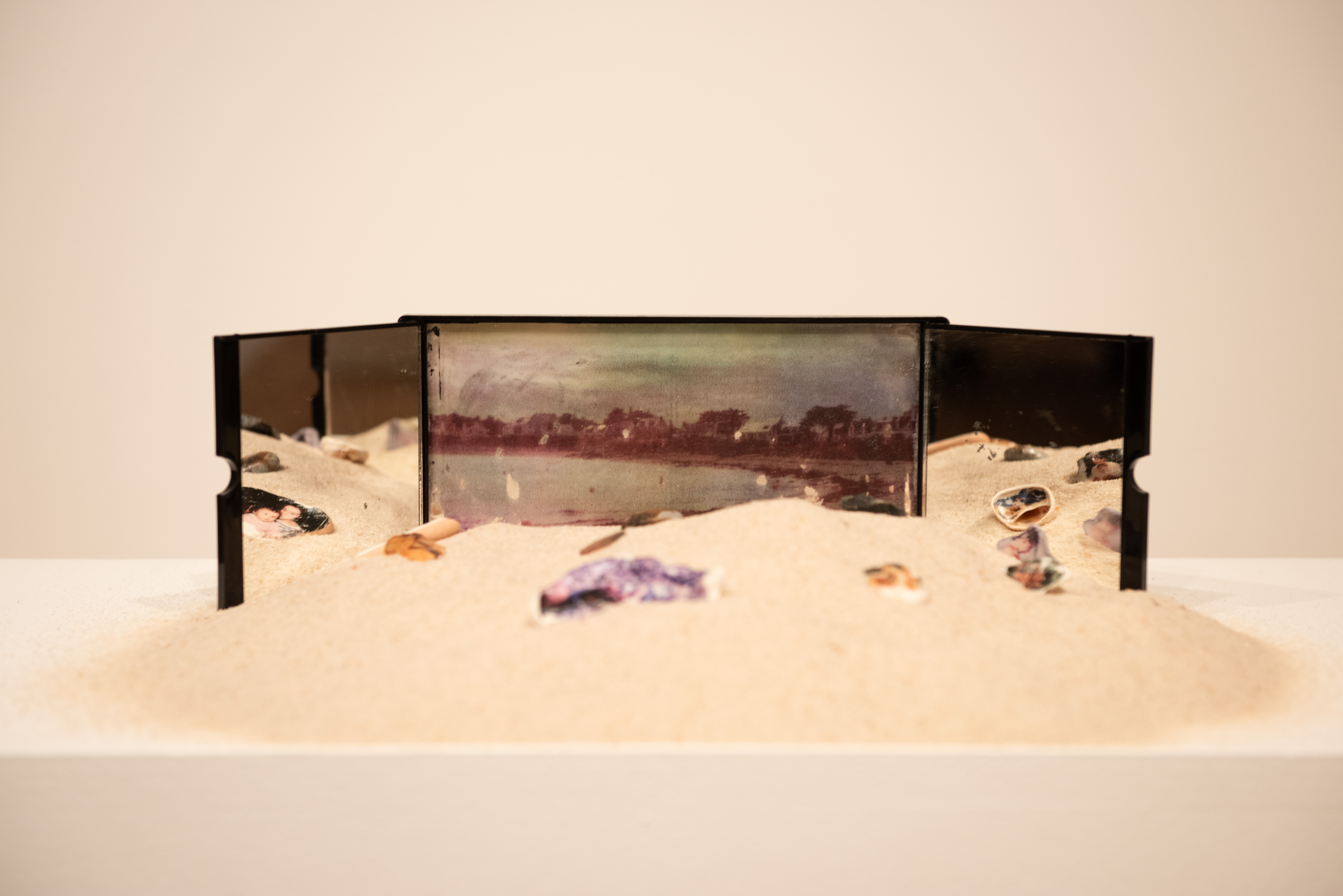 not a wasteland, but a poem - installation, photo printing on seashells and mirror (2023)