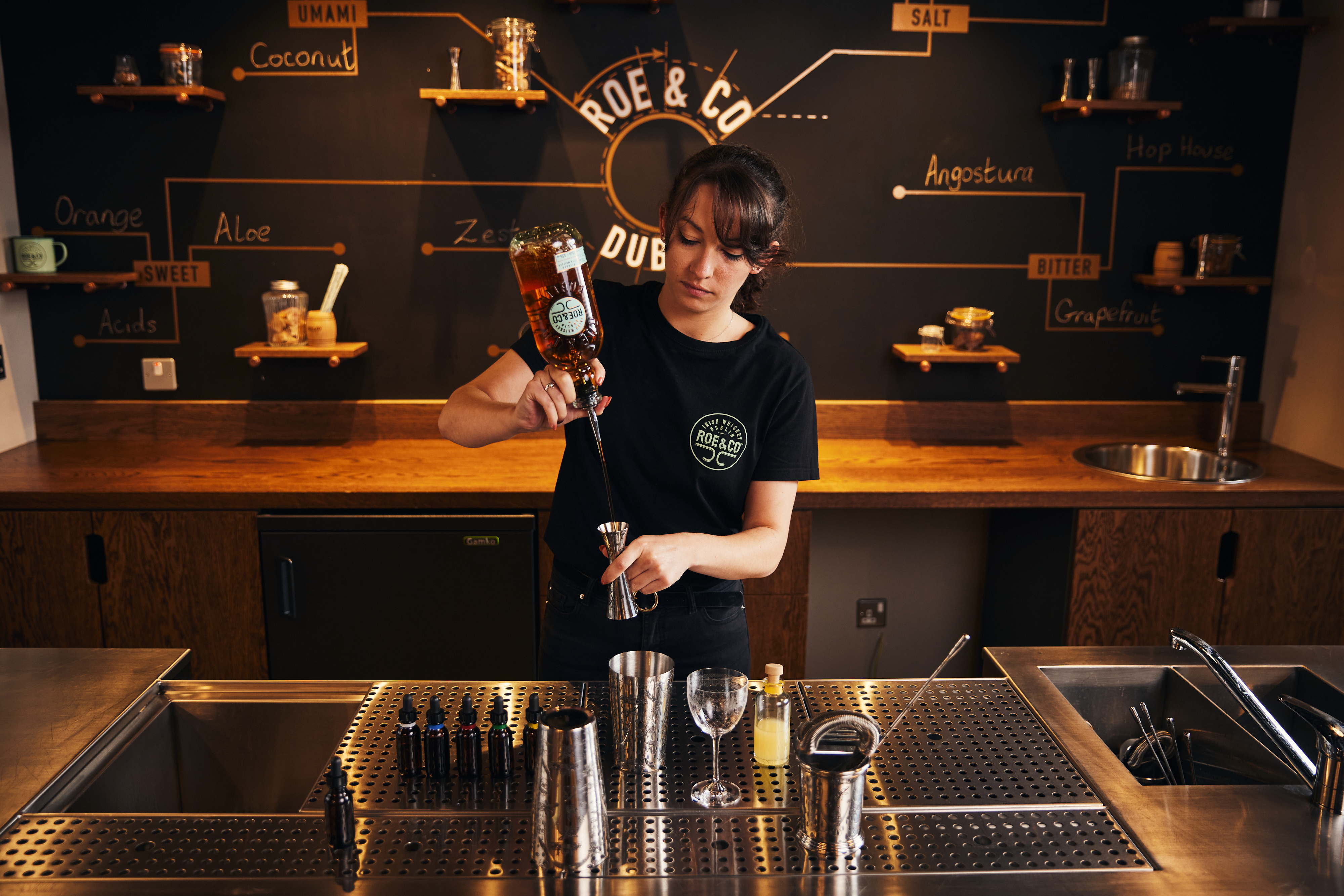 Lifestyle photography of the Roe & Co whiskey tasting and cocktail making experience in Dublin, Ireland. Captured by renowned lifestyle and advertising photographer Alex Sheridan, this photography showcases the sophistication and elegance of this exclusive experience. From the beautiful surroundings to the delicious cocktails, this photoshoot is a visual delight.