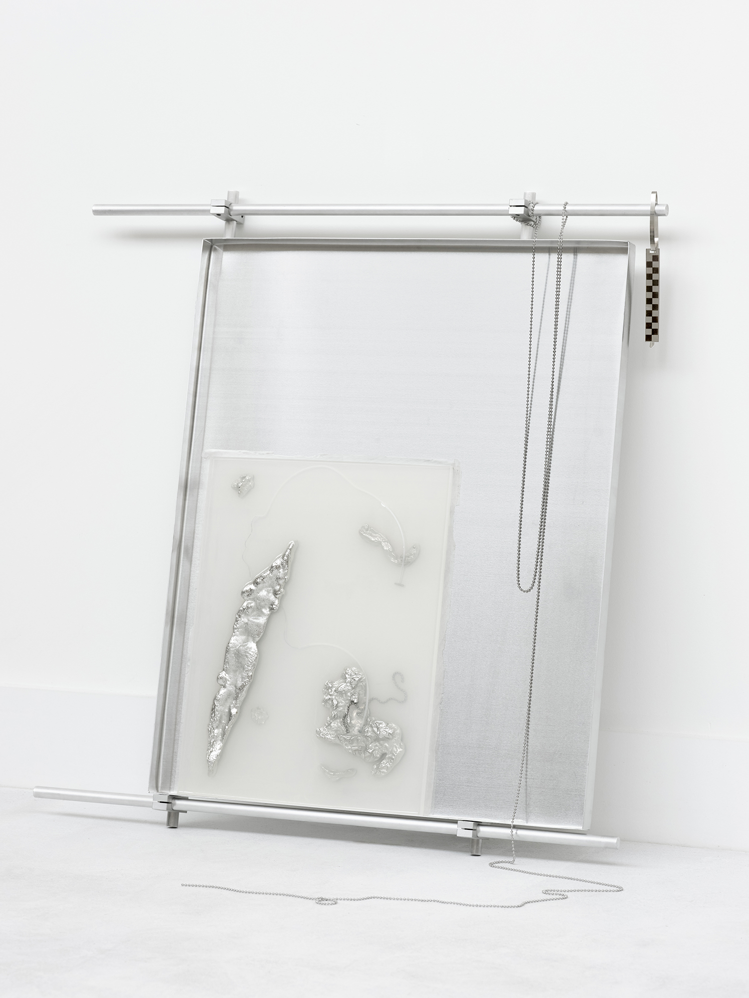 Imperma_38°00’04”N 100°54’43”E, 2024,  [60cm x 50cm x 20cm]  Eco resin, aluminium, pewter, labels, found metal components and drain chain 