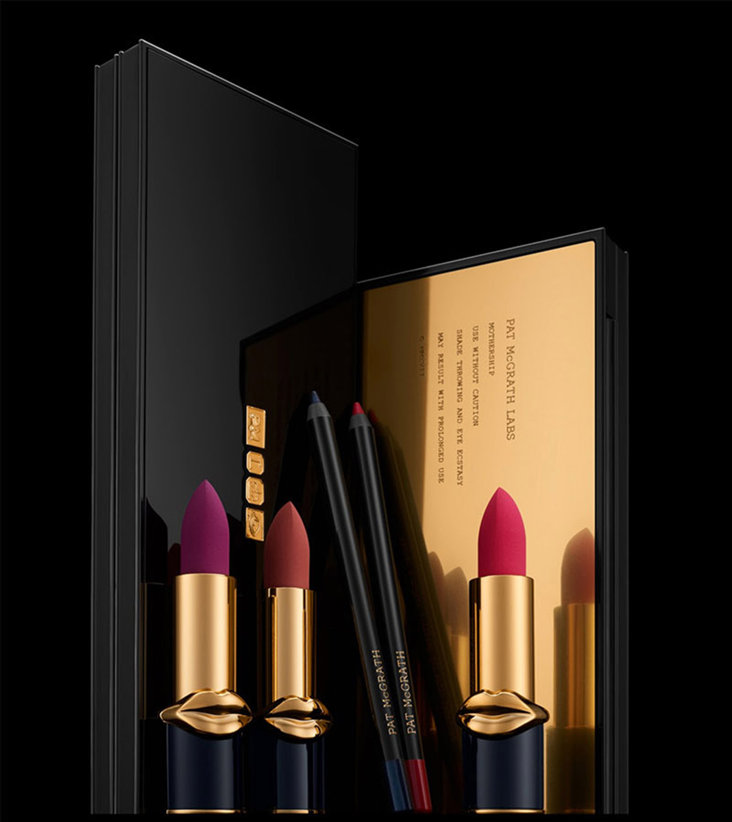 KMA stylist Rachel Haas designs set for photo of three colorful lipsticks with black and gold tubes for Pat McGrath