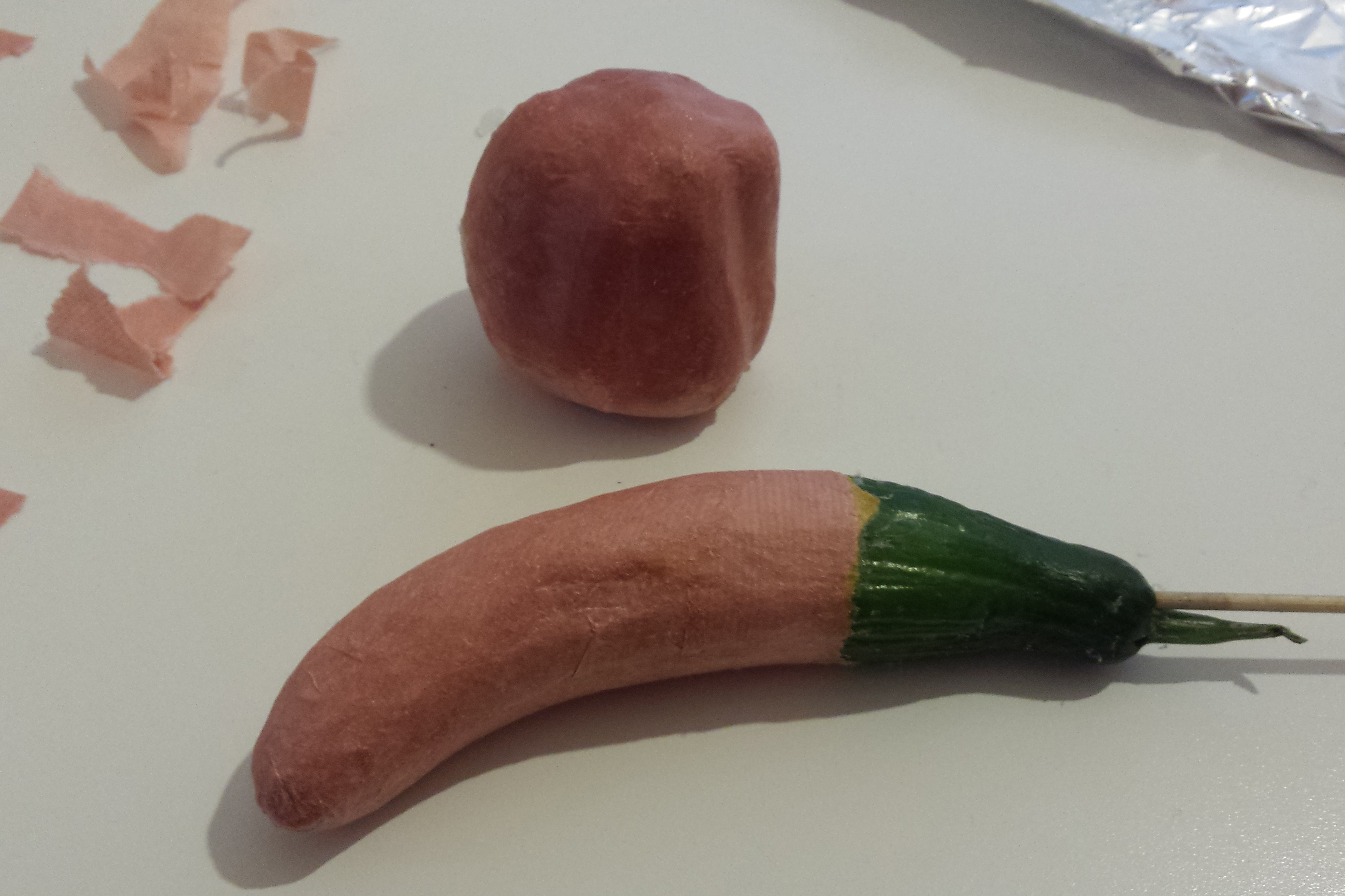 making noses from papier maché vegetables