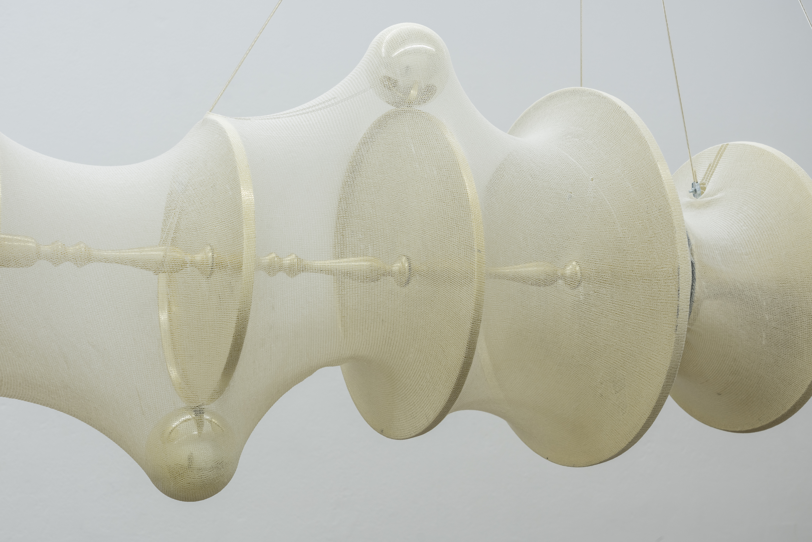 Just,  2023,  Ornamental steel display-shelves, stockinette, PVC plastic, wire rope.   dimensions variable