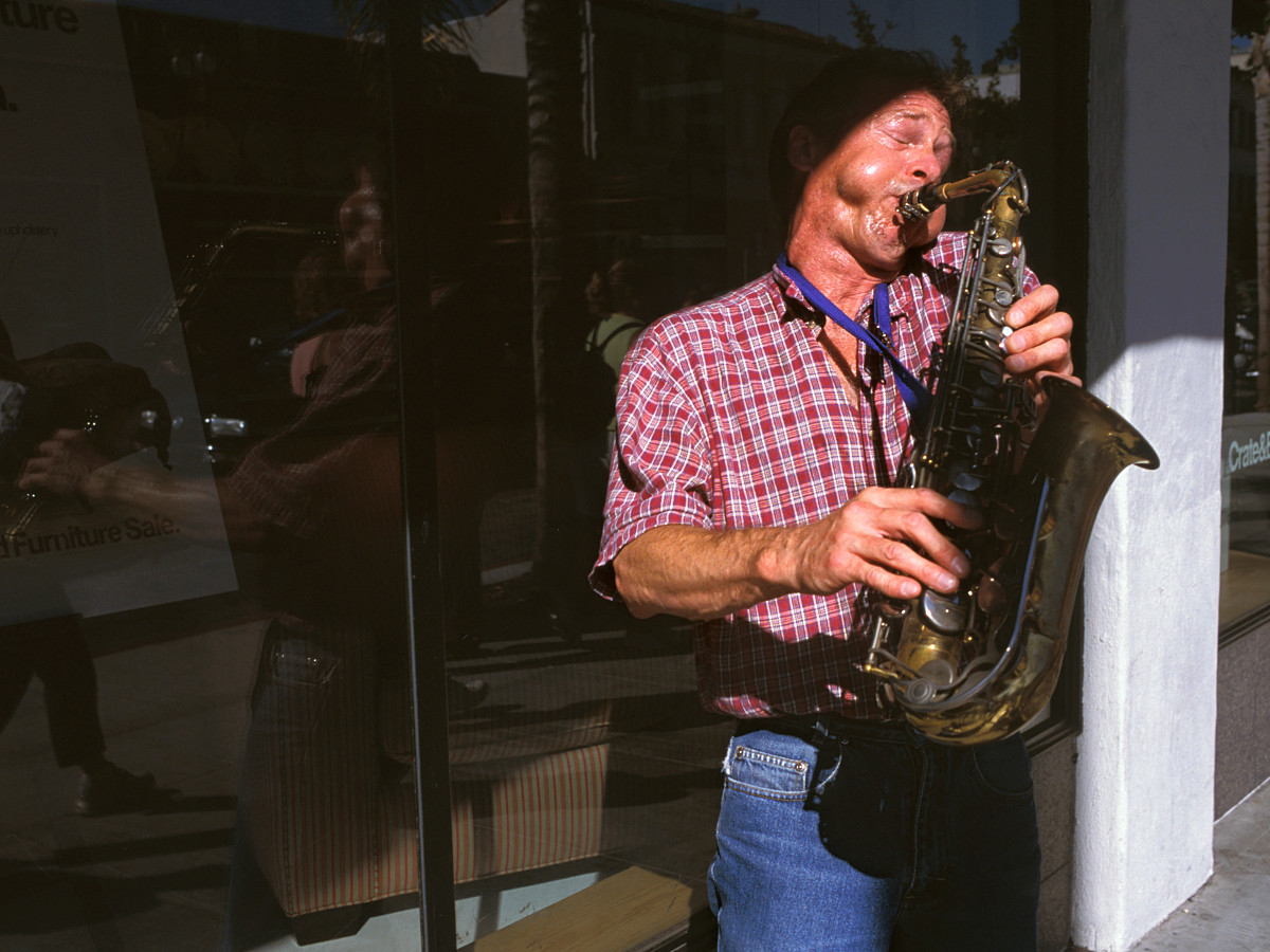 A street musician plays the saxophone in the Old Town district of Pasadena, California, on August 23, 2003. Ho-Yen Tsang—PCC Courier