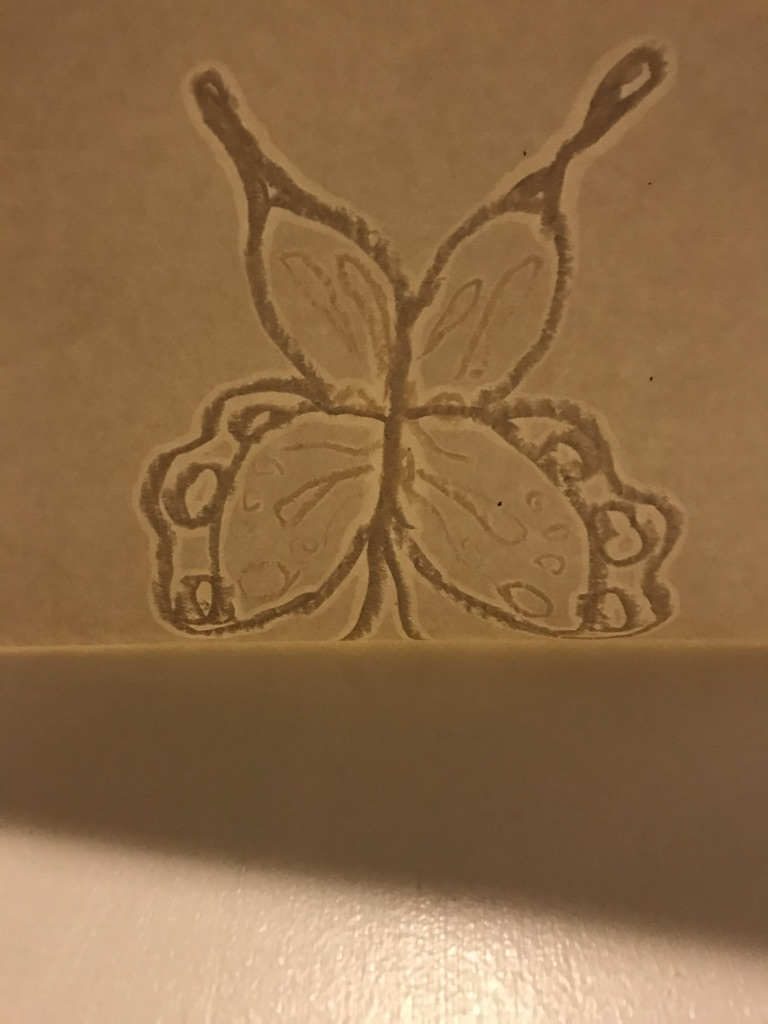 Burnt walnut on paper.