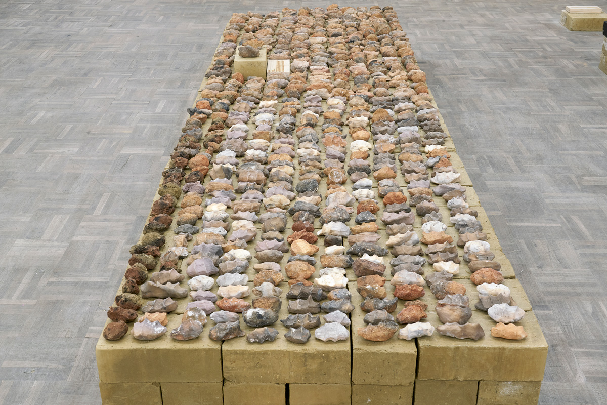 Dineo Seshee Bopape, footnotes, Lerole (2023) | Unfired clay bricks, various clays, beach gravel and sand from the Southernmost tip of Africa, pine wood plaques, approx. 30 x 90 x 300 cm