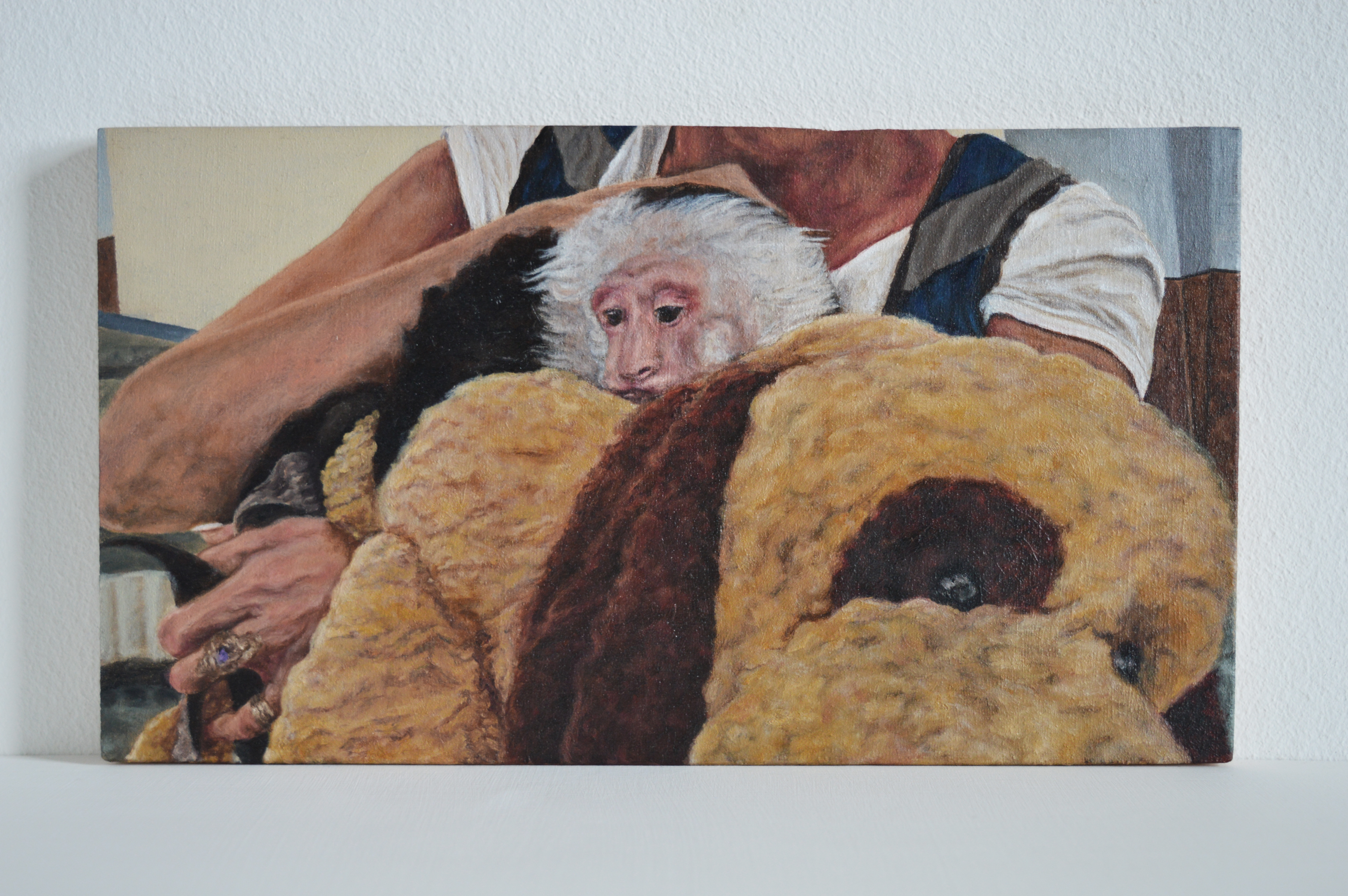 the monkey whisperer oil on plywood, 13cm x 23cm "Primate trainer Lisa has been showing monkey moms how to look after and tame their mon-kids for the last sixteen years. A legend in the mon-kid world, 45 year old Lisa is often called the monkey whisperer." Lisa's own pet monkey travels with her everywhere, and in this scene they are leaving the airport on their way to visit a client. While monkey trainers claim they can tame pet monkeys, wild animals cannot be trained like domesticated animals. Fear based, domination tactics are all too often used. And even after a degree of successful taming has occurred, monkeys may still lash out at their owners, causing life-threatening injuries.
