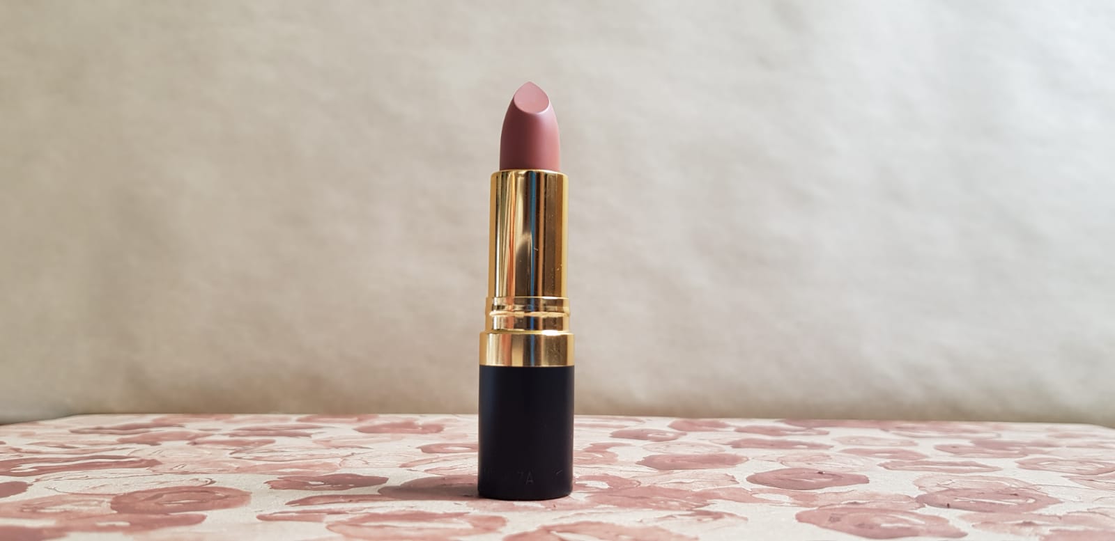 a photograph of the lipstick i originally tried to use for this part of the project, which didn't end up happening. in my opinion,  the use of lipstick added a feminine and personal element that i wanted to acknowledge despite not using it in the final pieces. 