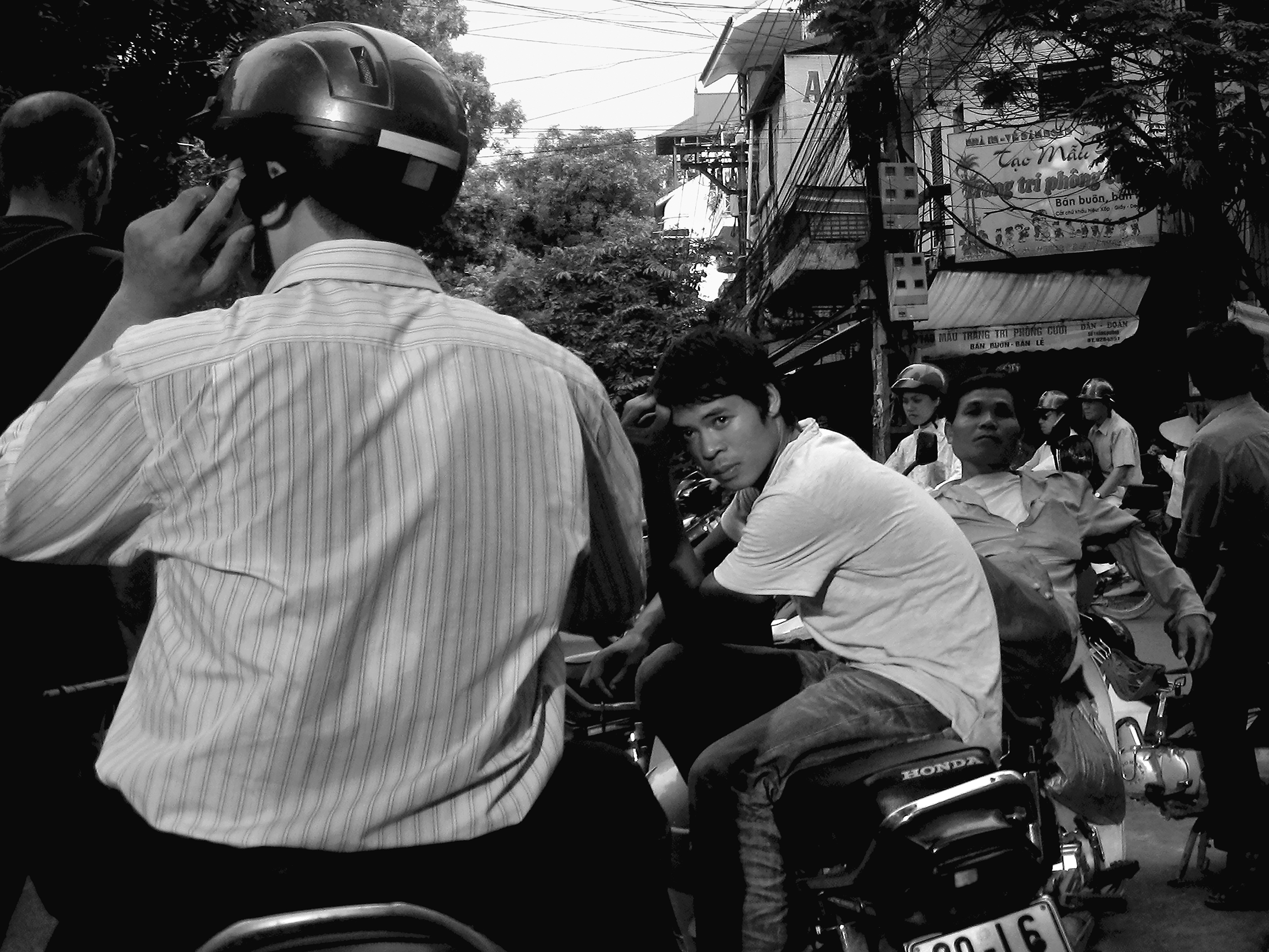 Mototaxi drivers waitingHanoi, Vietnam, 2008photography, single, bw