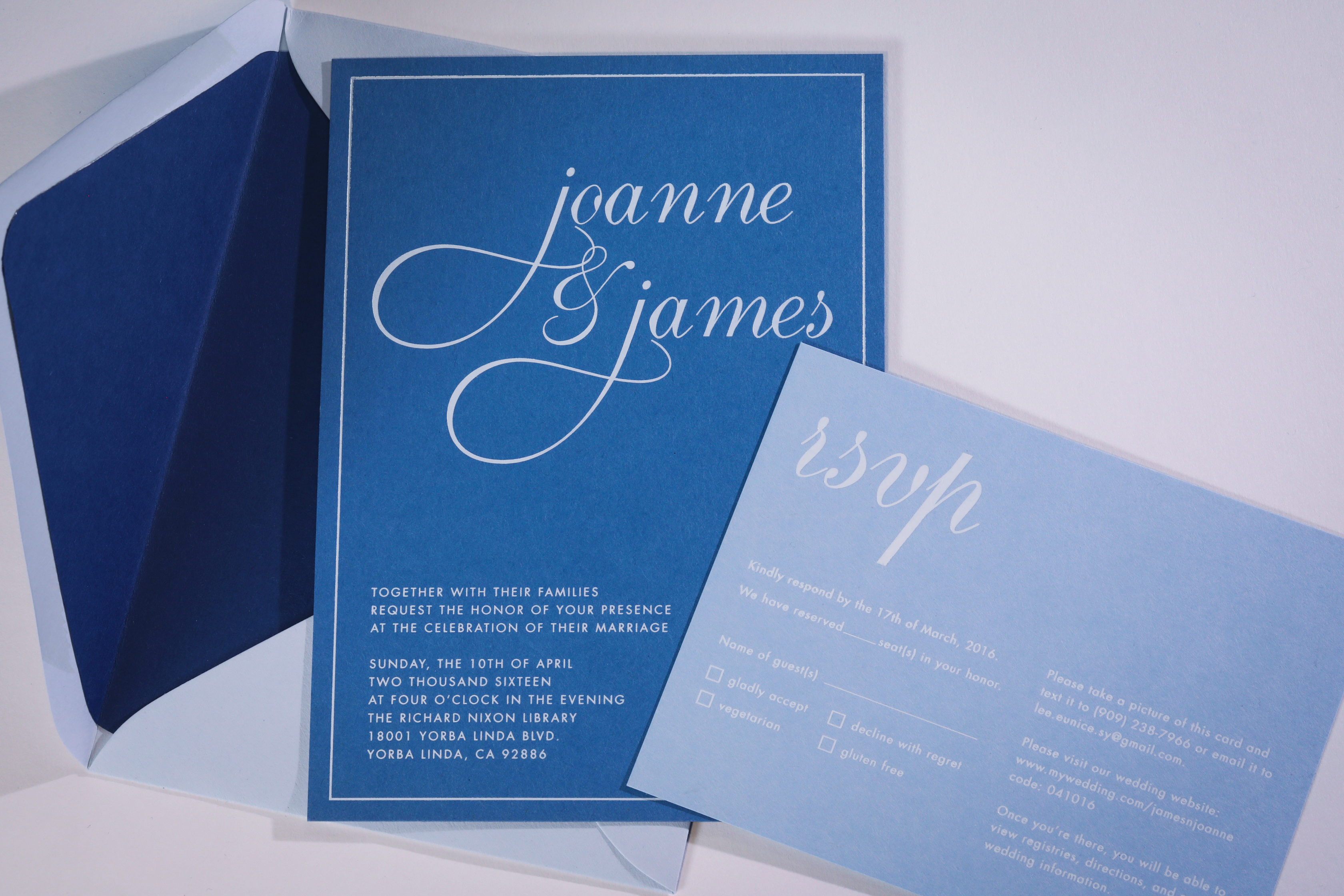 Joanne & James wedding invitation. White foil stamping on blue papers.