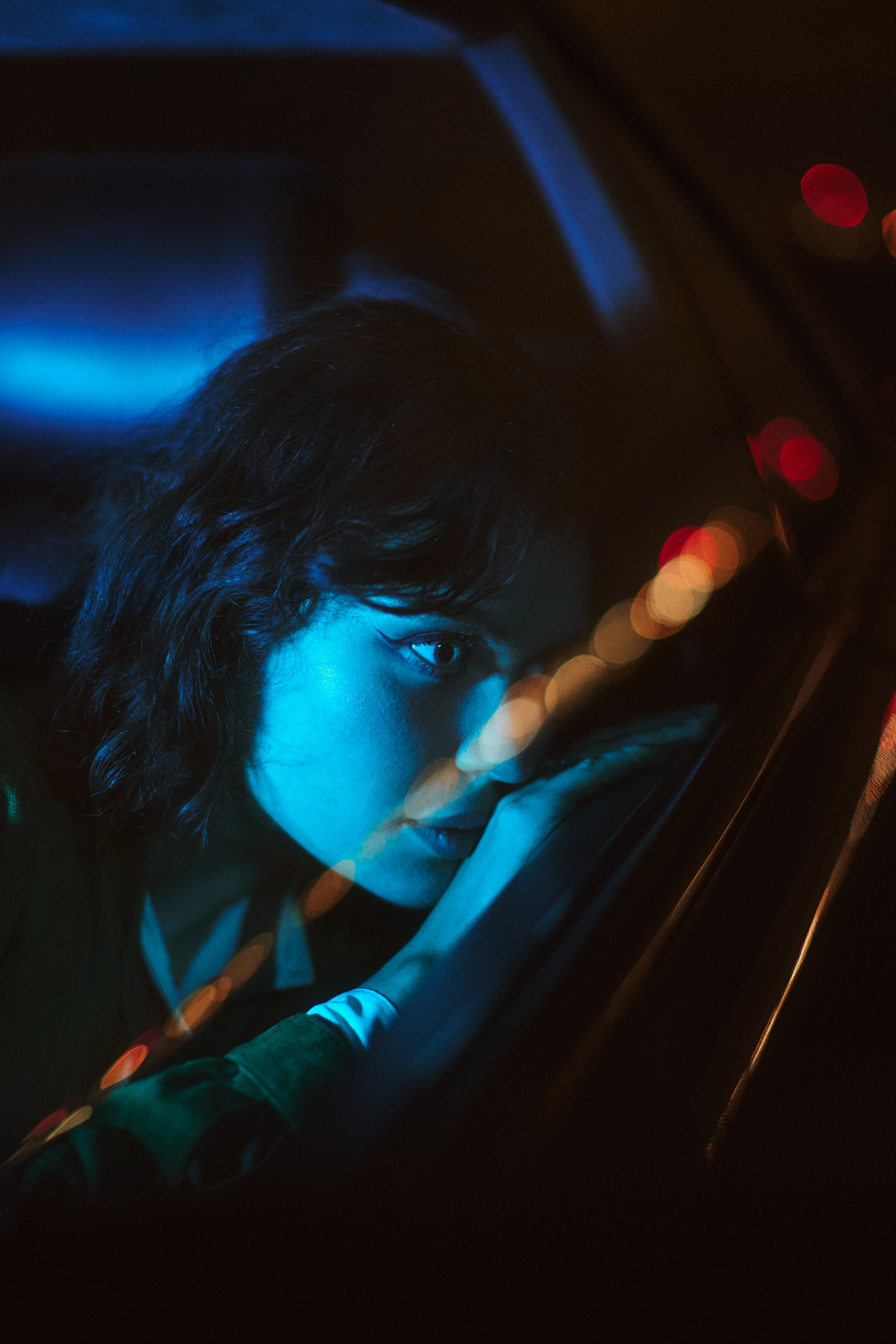 A story of young love in the suburbs told through photography, featuring stylish models in vintage clothing, photographed at sunset in Dublin, Ireland by fashion and lifestyle photographer Alex Sheridan. Suburban Love photo series. Featuring a vintage 1993 Mercedes Benz SL class and cinematic lighting and red light. Euphoria inspired photoshoot.