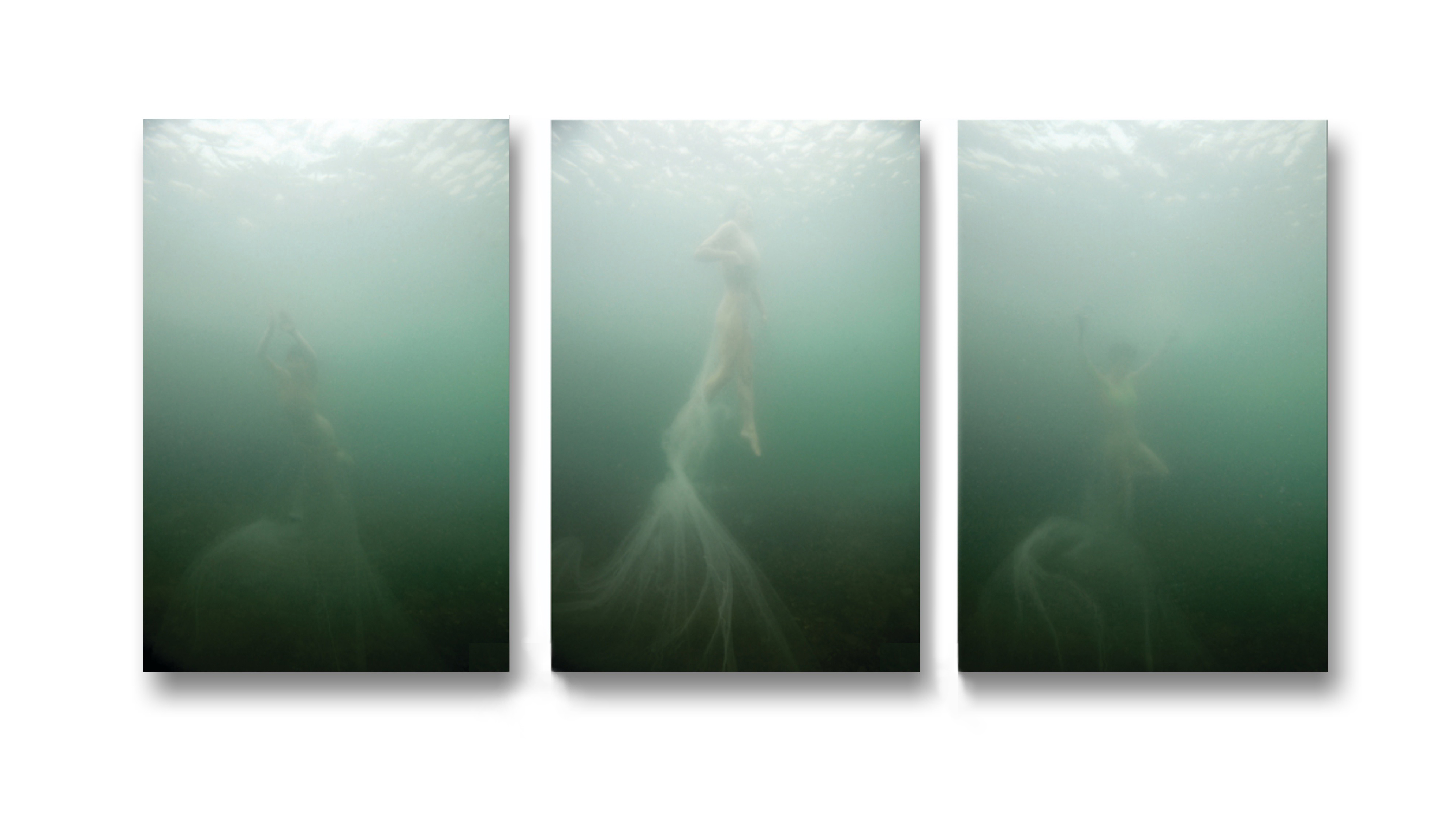 Lacrimosa I, II & III2011Documentation of underwater performance in the Guernsey sea Kirstie wears a dress knitted out of 20,000m of fishing lineSupported by the Guernsey Arts CommissionC-type photographic print on metallic paperPhotograph:John Higginson90cm x 40cmEdition of 3
