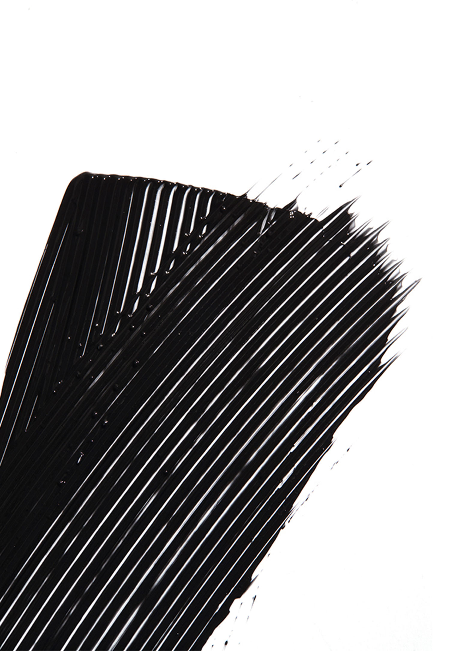 KMA stylist Sara Wacksman designs set for texture photo of black mascara smeared on a white background for Kjaer Weis