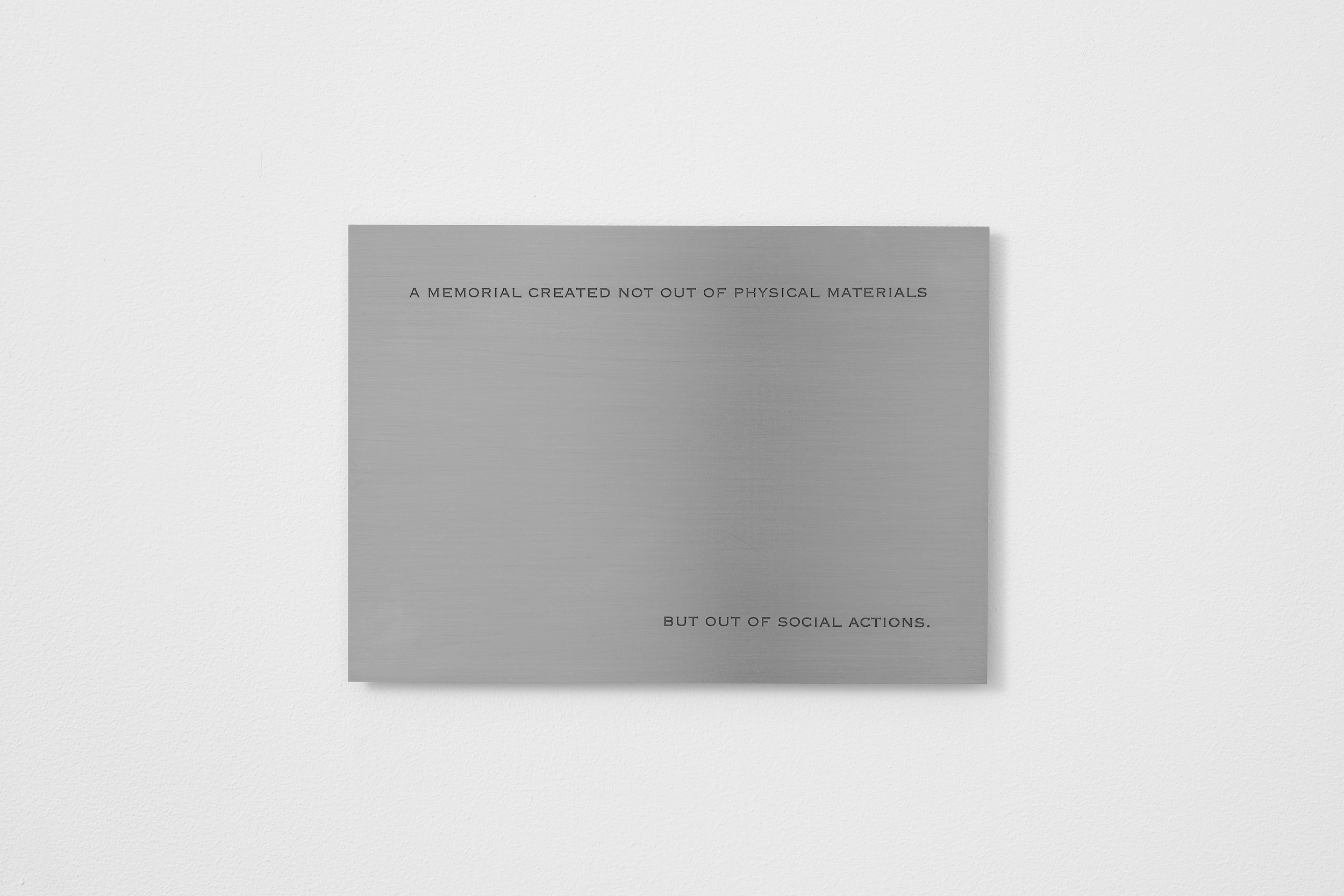 James Webb, A memorial created not out of physical materials but out of social actions (2025) | Text, engraved stainless steel, magnets, 12 x 18 x 0,2 cm