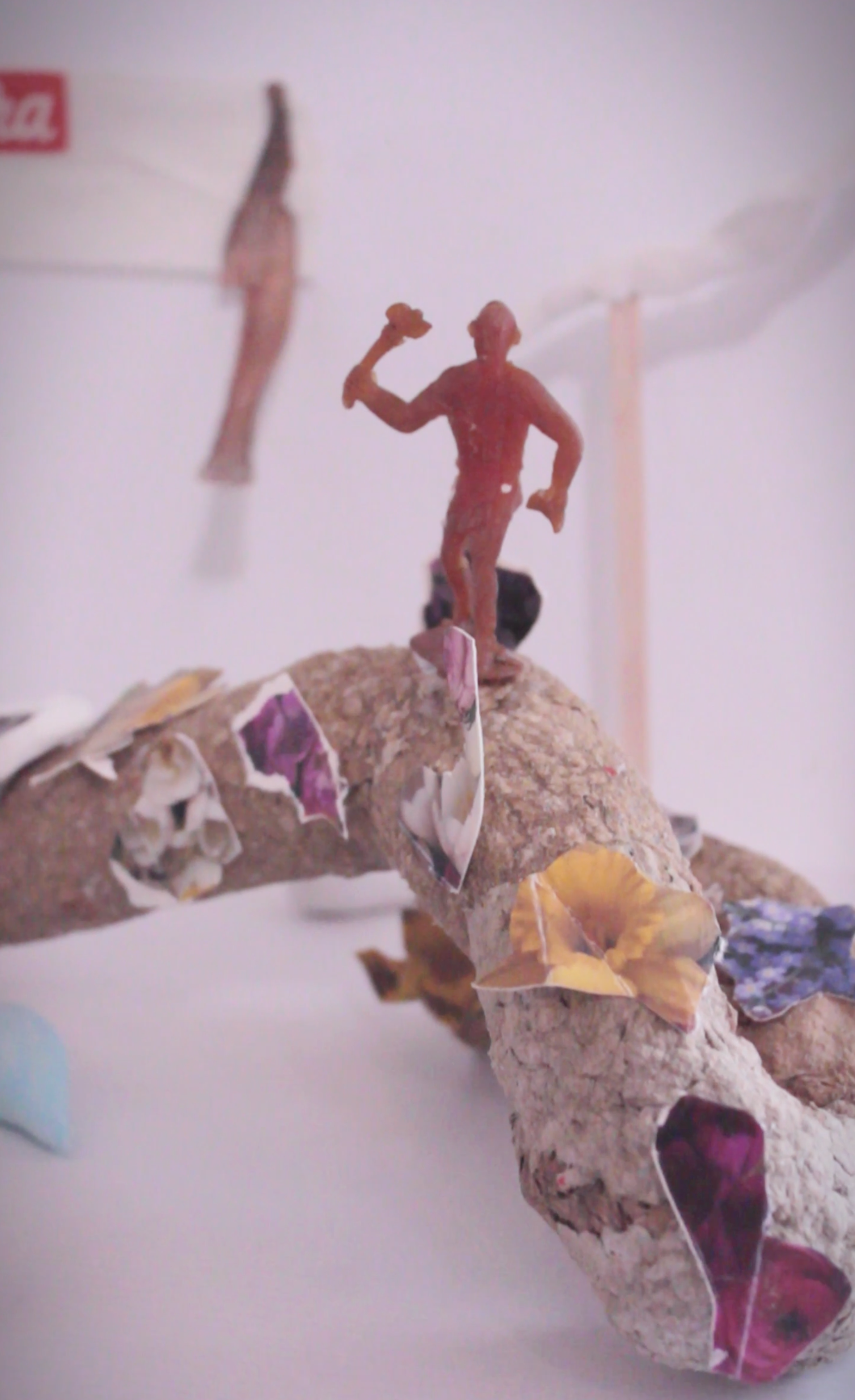 (Detail of the installation) Exposi&ccedil;&atilde;ozinha [Little Exhibition], 2023magazine, packet and paper cut-outs, papier mache, acrylic paint, fabric, dried flowers; 140x80x40cm