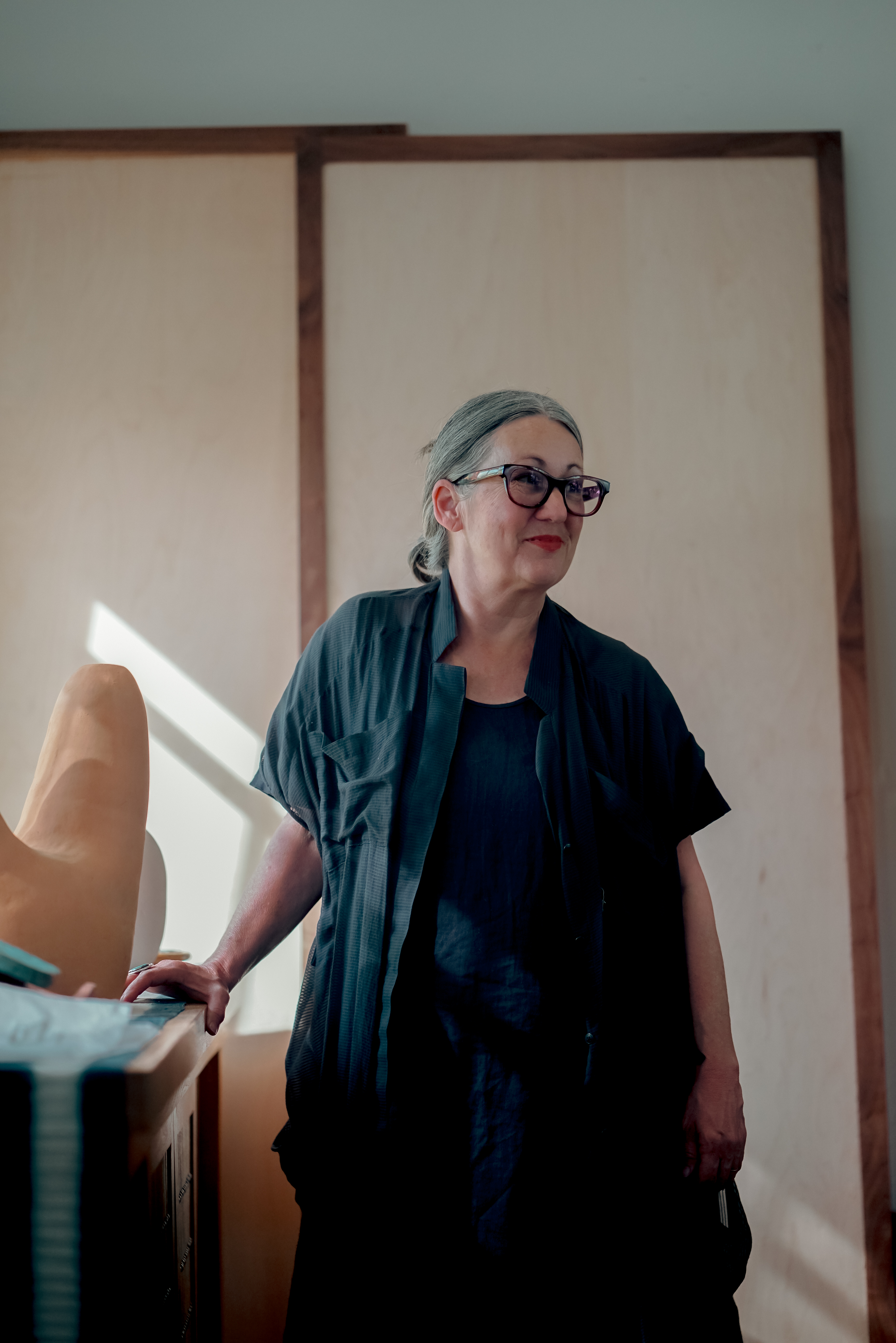 Natural light illuminates Leslie's corner of the studio.