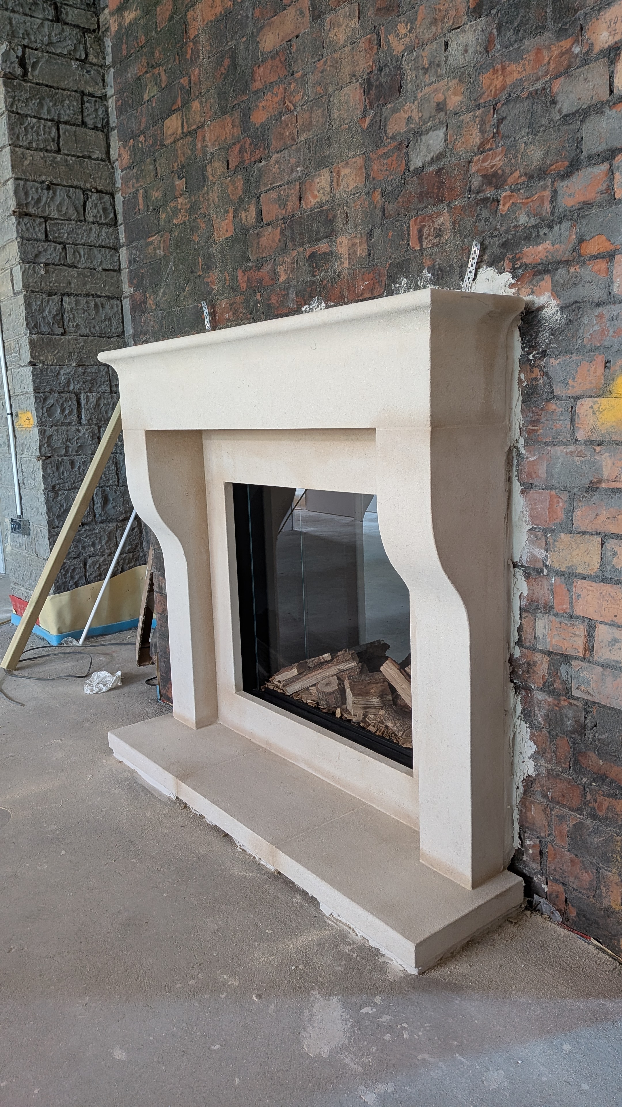Contemporary farmhouse in distressed Bath stone, with bath slips and electric stove insert