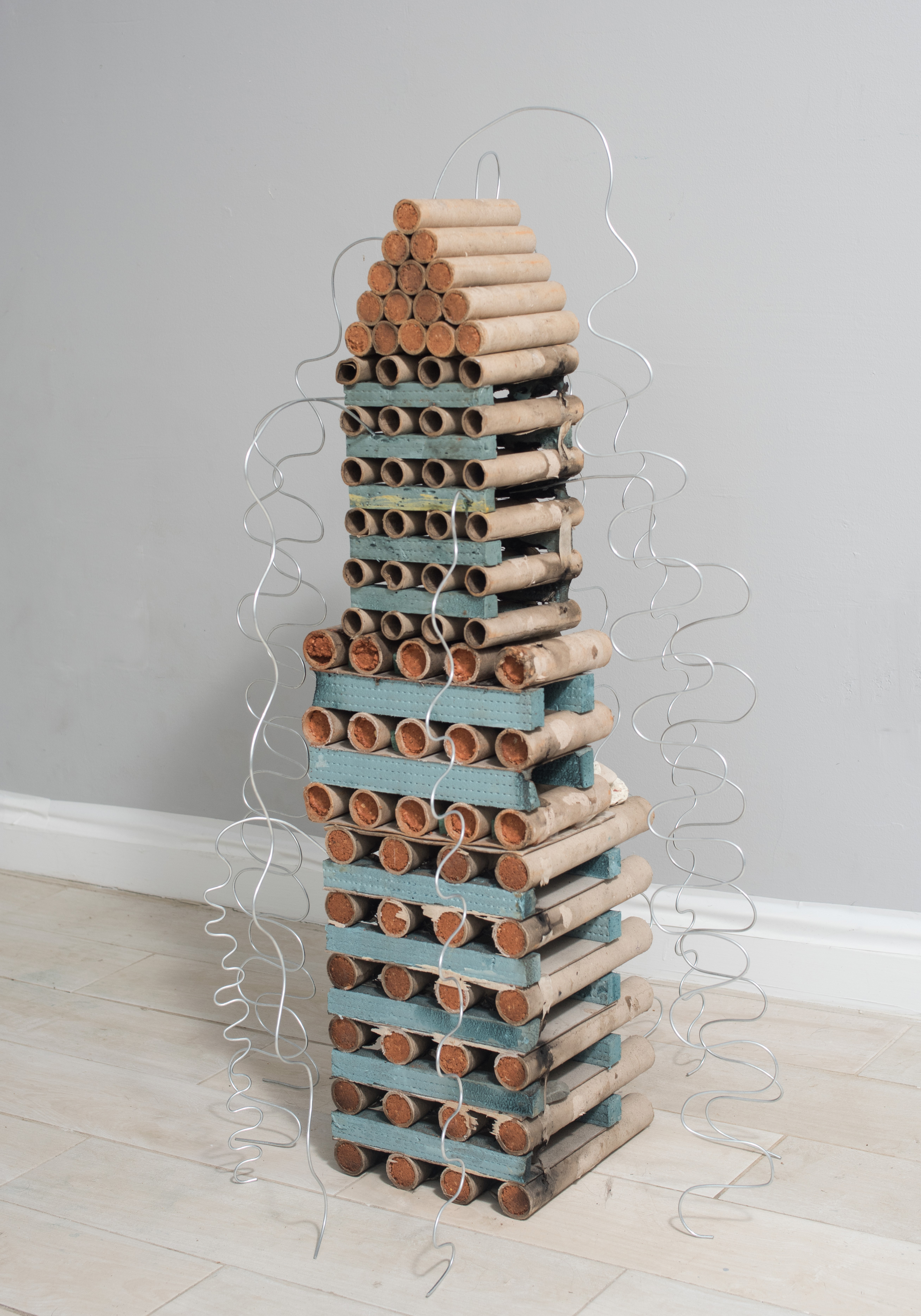 Water Tower, 2023, Found firework refuse, wire, found objects, aquaresin, 12" x 48" x 12"