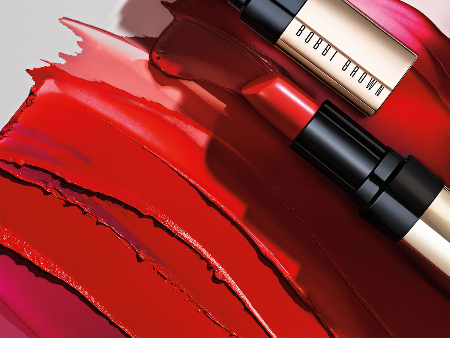 KMA stylist Sara Wacksman designs set for texture photo of smeared shades of Bobbi Brown lipstick against white background 