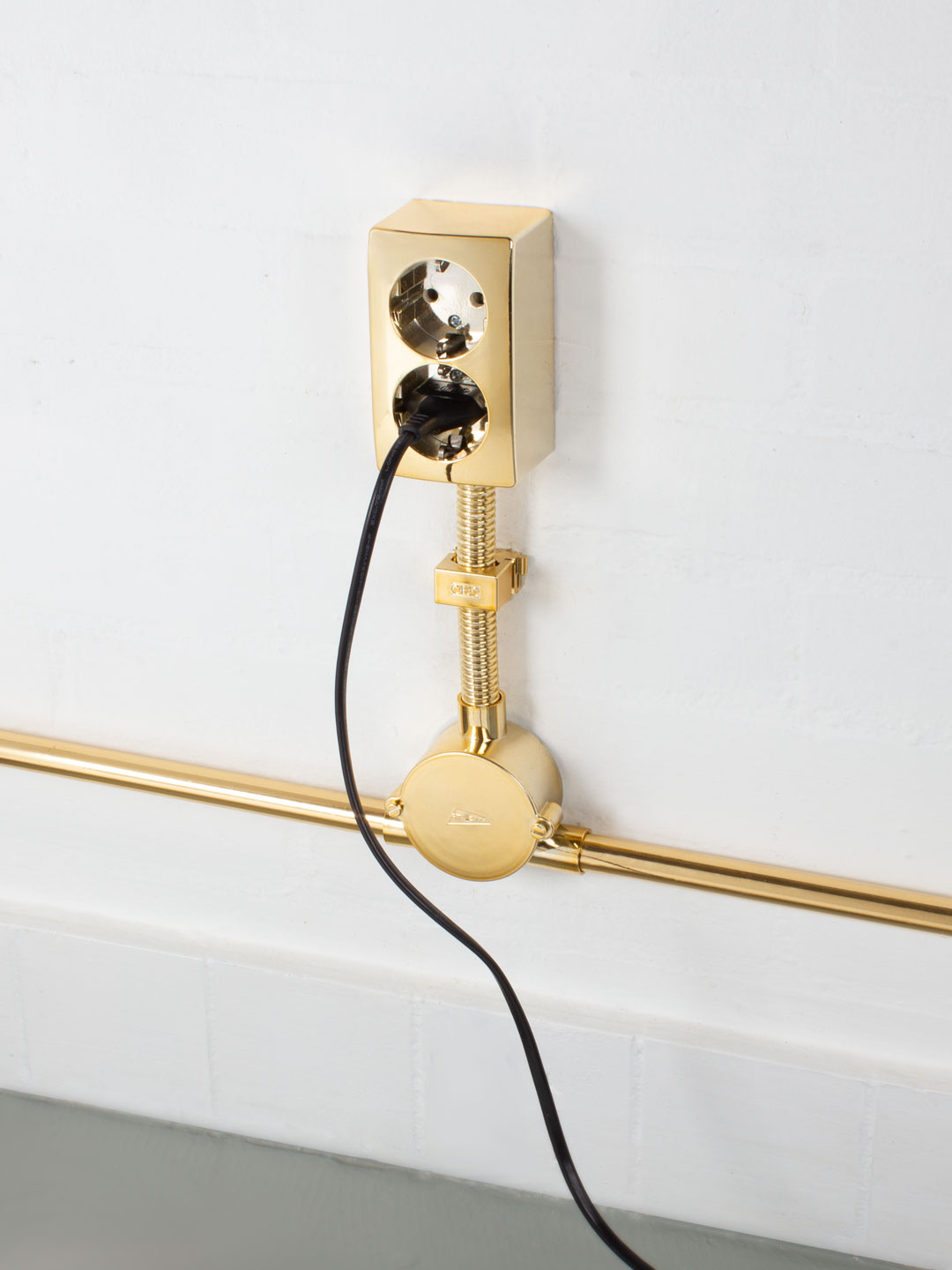 Gold CircuitIn 2005 I was asked to participate in an exhibition in a school building that was soon to be demolished. The building was in such a bad state that the electrical circuitry didn't work anymore. So I installed a brand new shiny golden electrical emergency circuit in the hallways and the in exhibition spaces