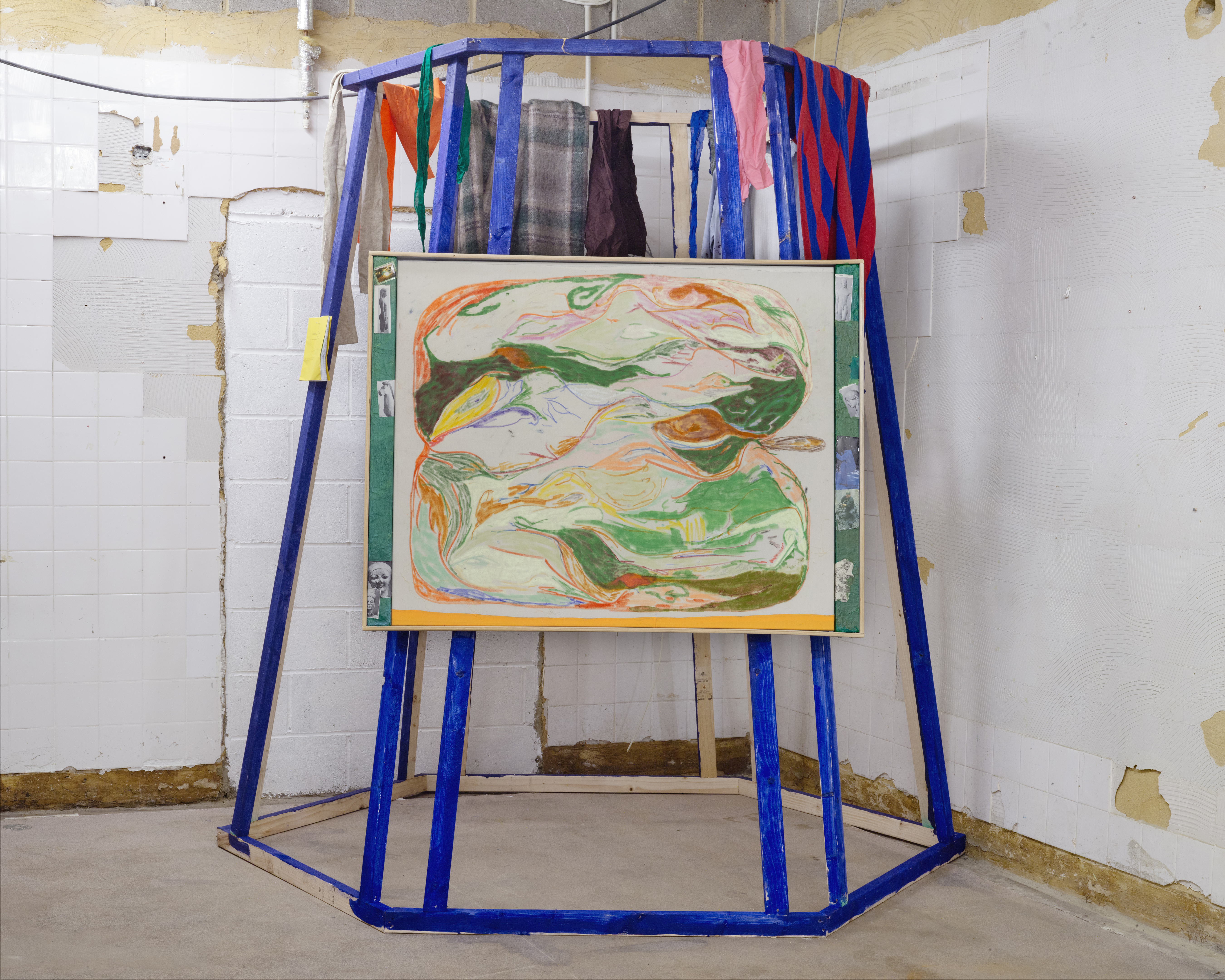 Weather Station, 2025, 247x242x208cm, comprised of: I) Untitled (Apple 16), 2025, oil, soft pastel, & watercolour pencil on cotton, W/ ply, photo-cut-outs, plaster, & acrylic 104x136x5cm II) Thermal top, artist’s shirt, wooden hanger, & various fabric scraps III) Artist’s Notebook W/ nail