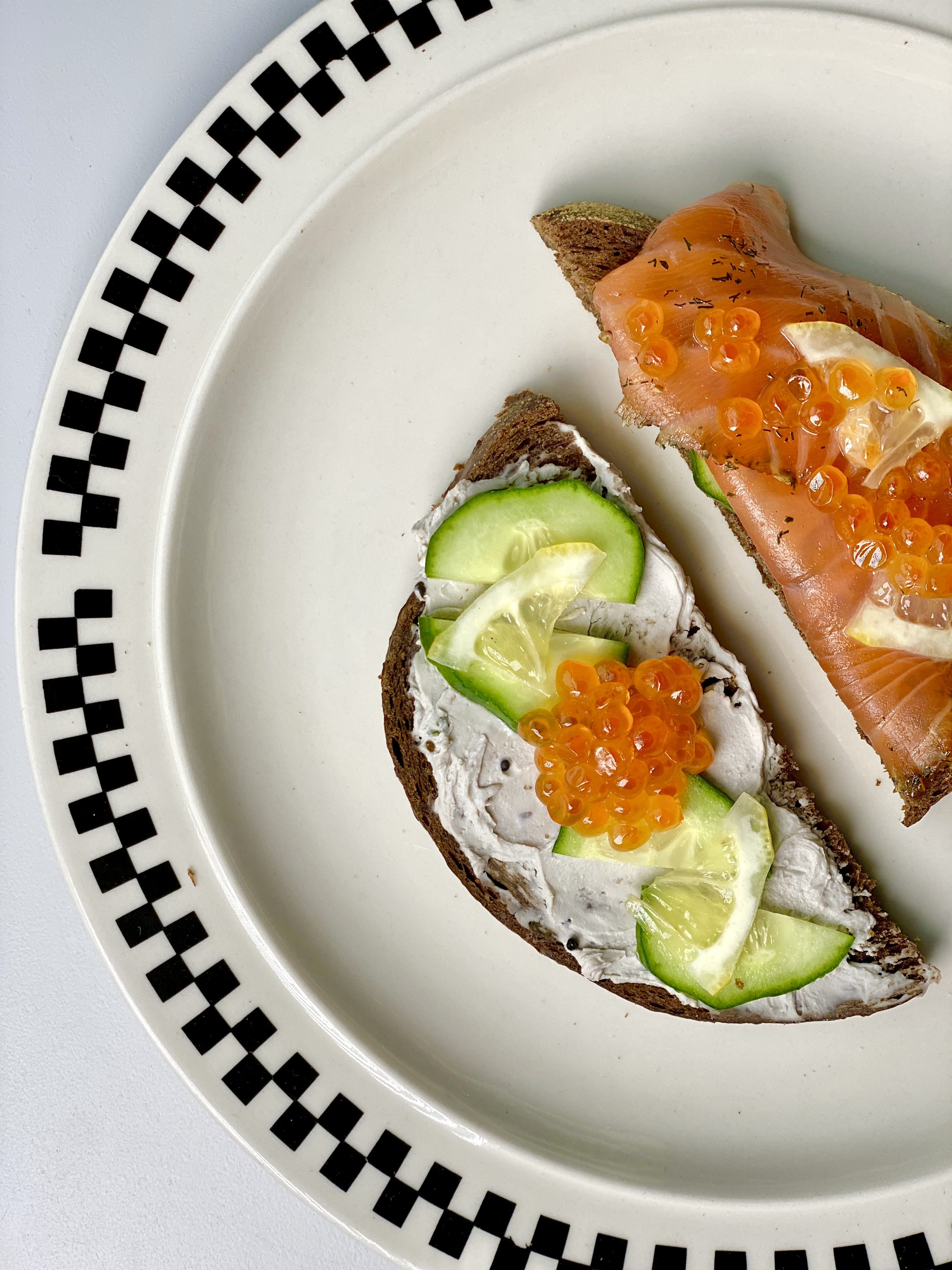2Part Toast w 1/2 caviar cream cheese and 1/2 cucumber and gravlax...both topped w lemon and salmon roe :)