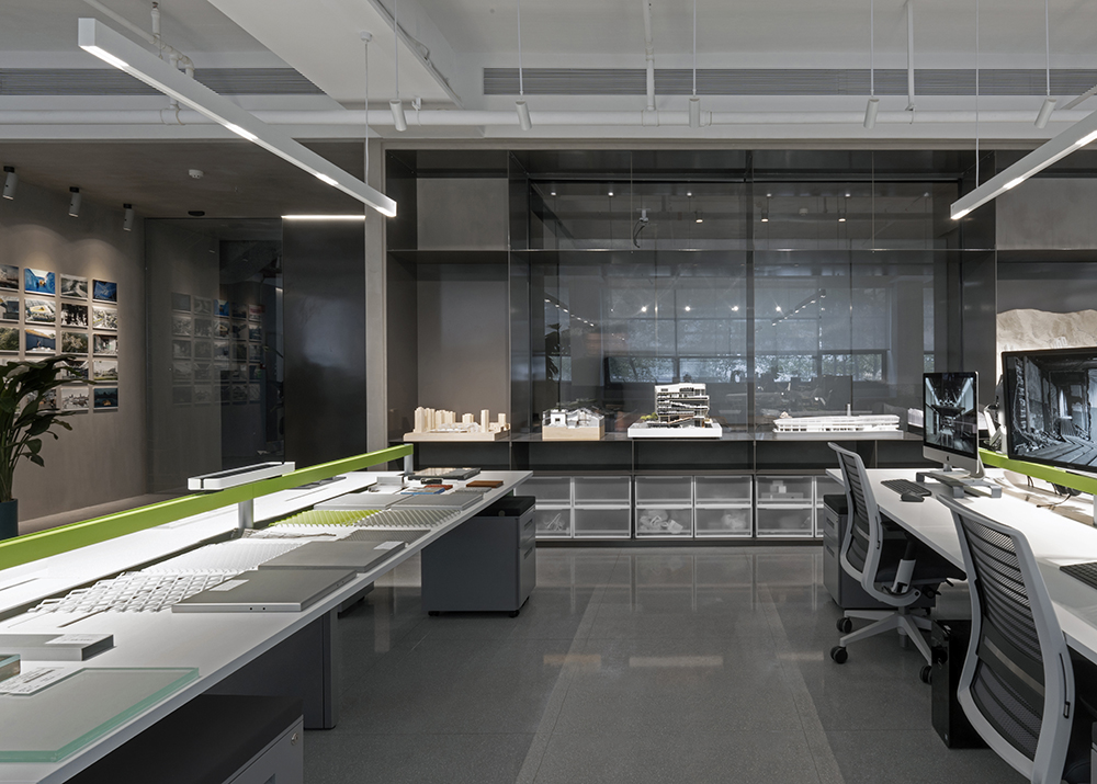 exhibition cabinet with models and meeting room in the back