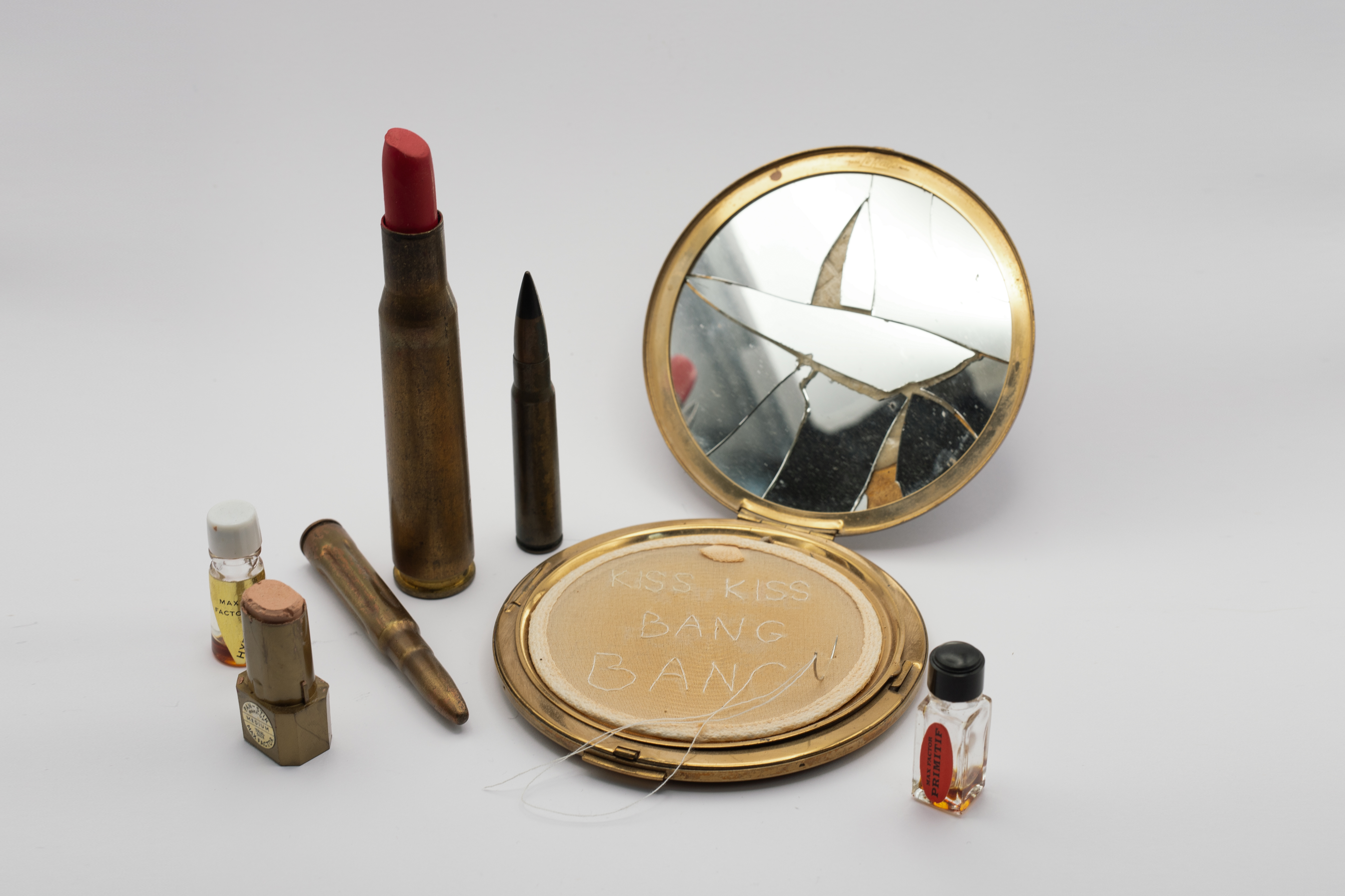 Kiss Kiss Bang BangMixed media with lipstick and powder compactDimensions variable