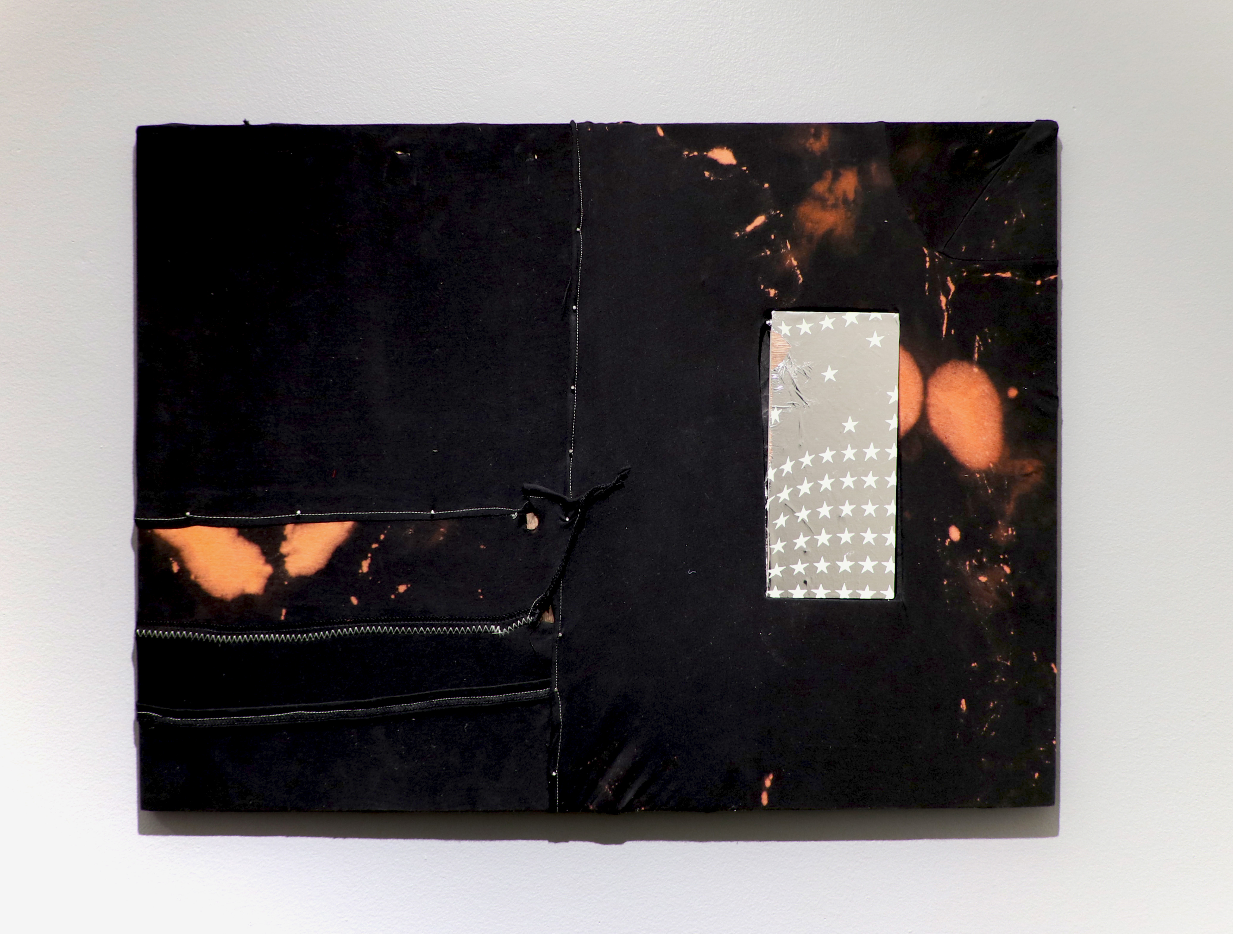 graduation (2024.) bleach, t-shirt, acrylic metallic film, nails.  32&rdquo; x 24."