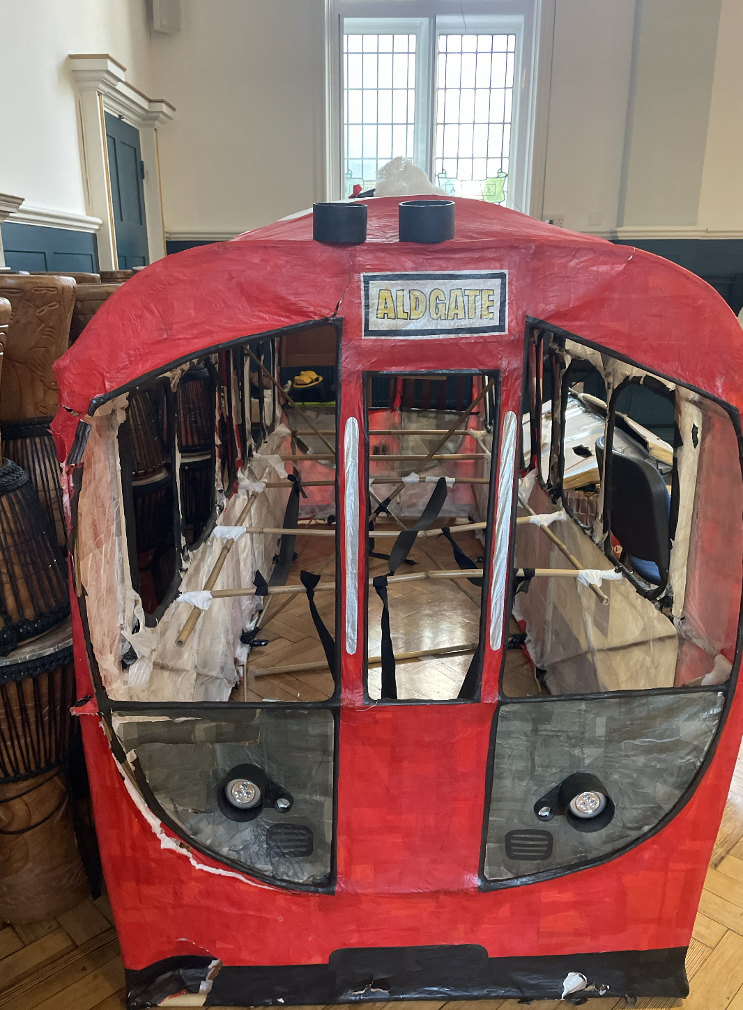 In 2024, I collaborated with Key Stage 2 students at Aldgate Primary School on the theme of 'magical modes of transport.' Together, we crafted woven wicker frames and vibrant tissue paper sculptures, exploring connections between sculpture and performance art along the way.