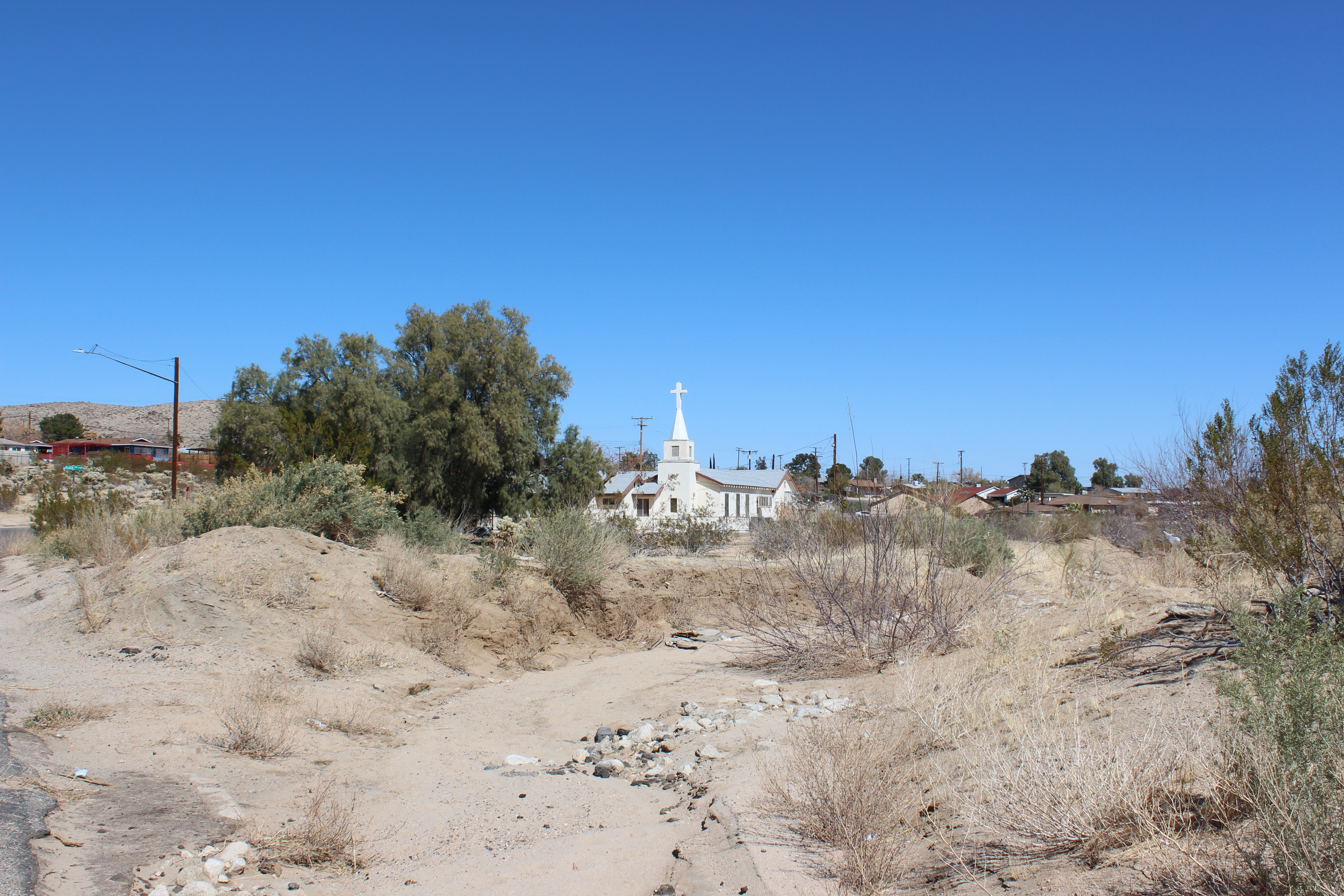 Community United Methodist Church through a sandy wash
