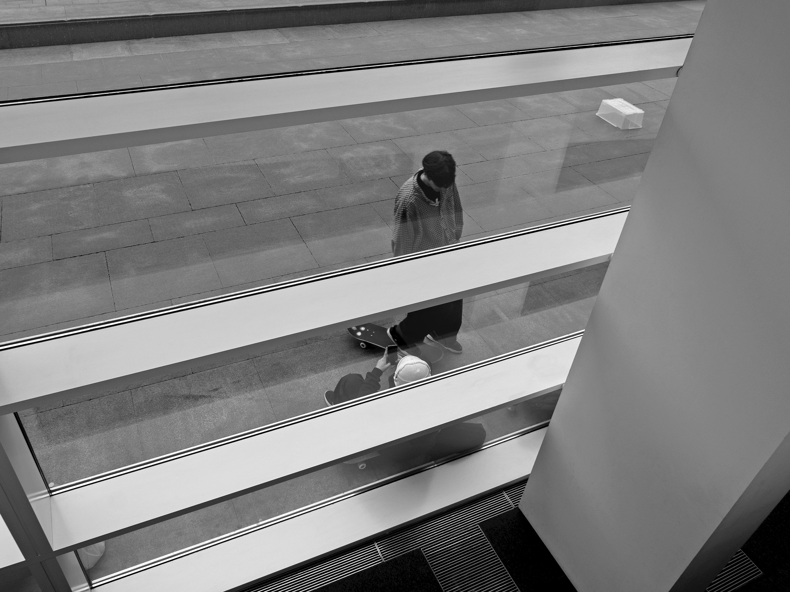 Young skaters resting Barcelona, Spain, 2023photography, bw, single