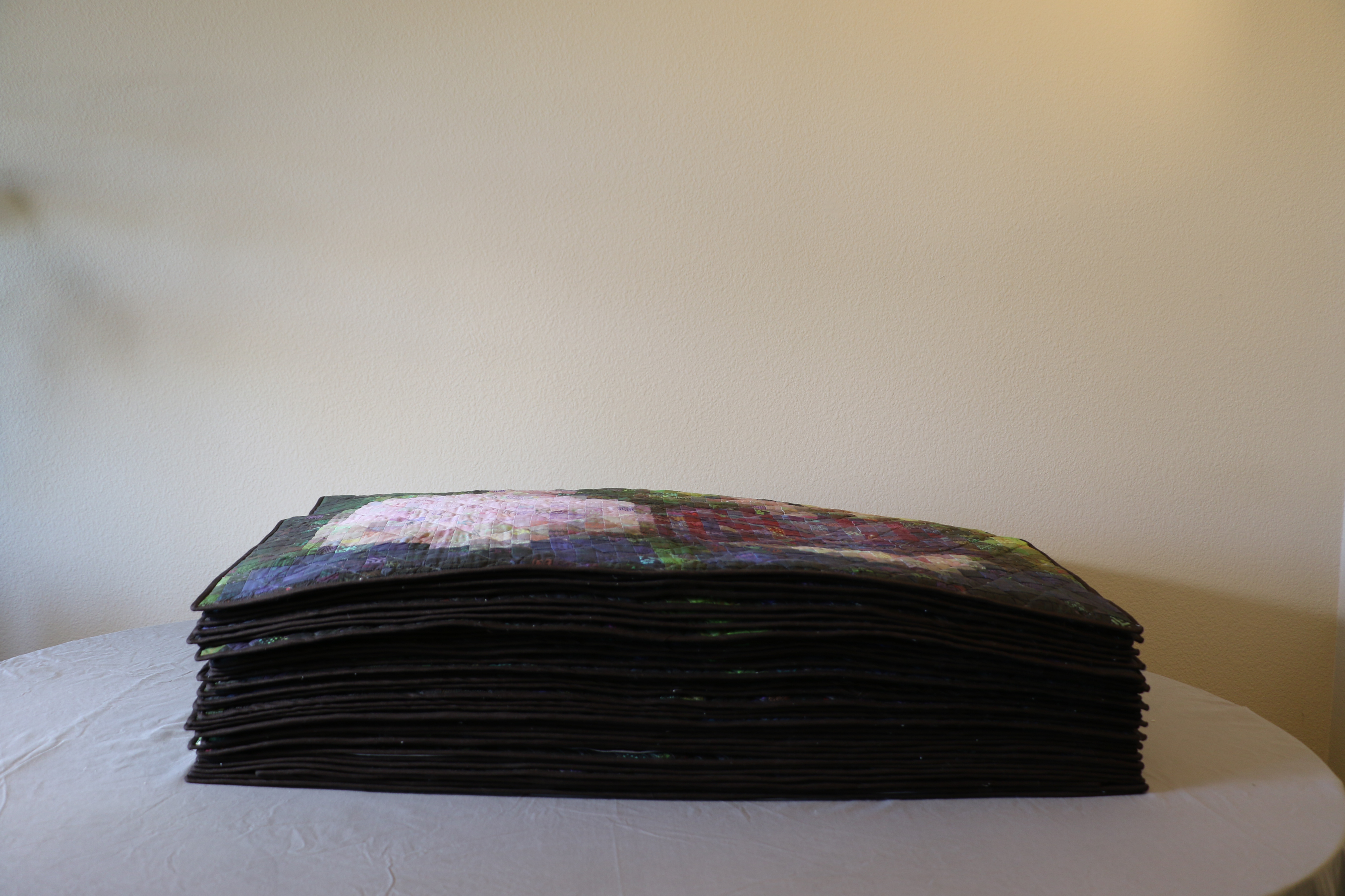 stack of 36 quilts, 36" x 48"