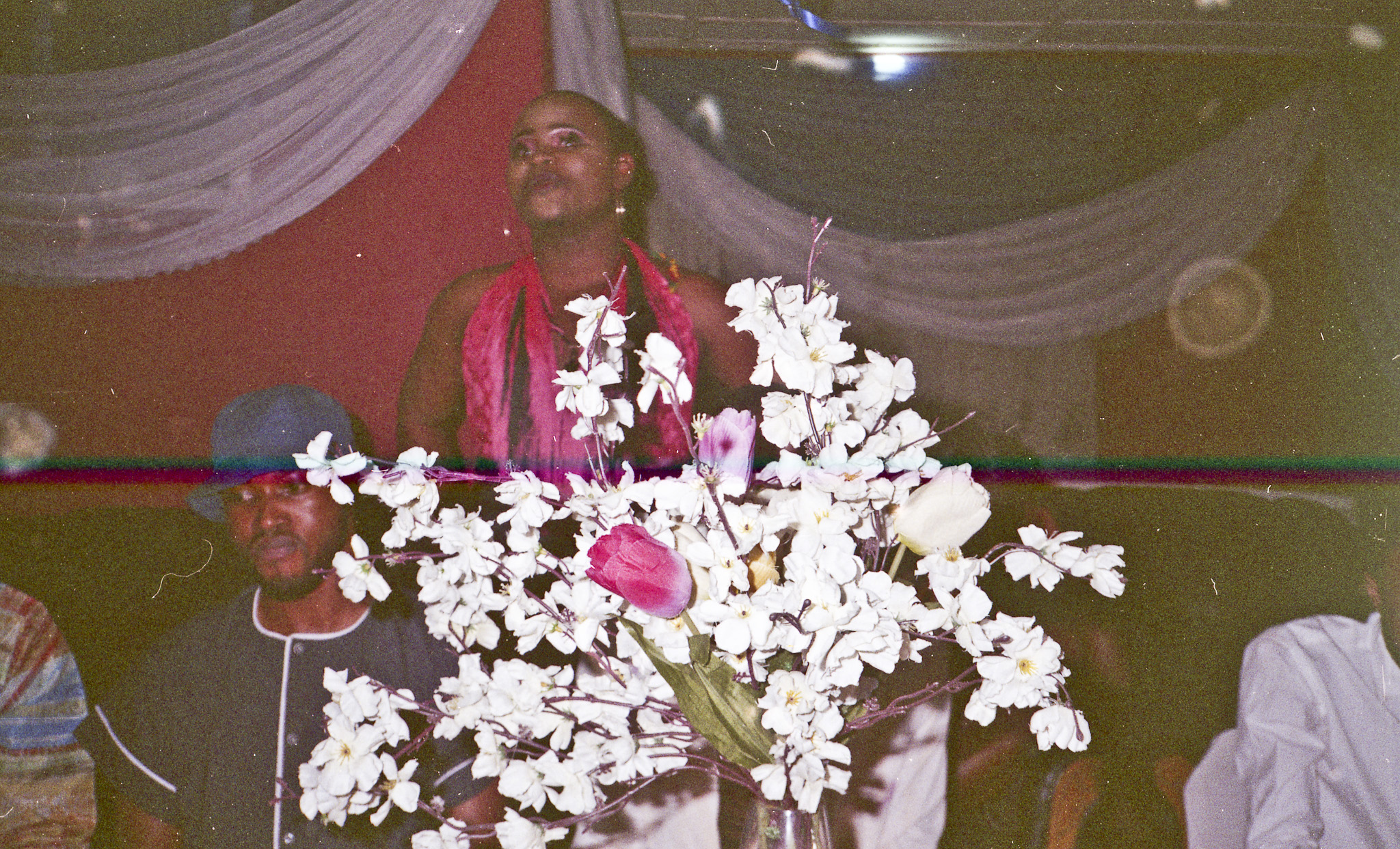 Sabelo Mlangeni, Olalere giving words of appreciation at my farewell dinner (Mohamed, Smith, Mr Morrison, Lil B, James Brown, Ruby, Tonnex, Daniel, Olumide, Chef Anthony, Sodiq) (2019) | Digital ultrachrome archival print