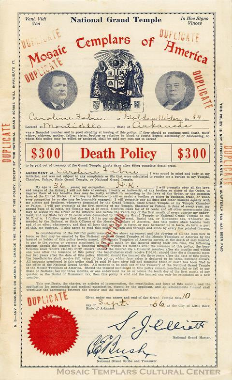 Image: The Mosaic Templars of America $300 Death Policy for Caroline Febue. Febue belonged to the Golden Victory Chamber, No. 84 in Monticello (Drew County), Arkansas. The MTA National Temple in Little Rock (Pulaski County), Arkansas created and issued the policy on September 10, 1906. The document was signed by MTA National Grand Masters S.J. Elliott and National Grand Scribe and Treasurer Chester E. Bush. The policy is stamped with the word “duplicate” multiple times and is printed on white paper with blue and red ink, with circular portraits of two people at the top. Mosaic Templars Cultural Center Collection, Mosaic Templars Cultural Center.