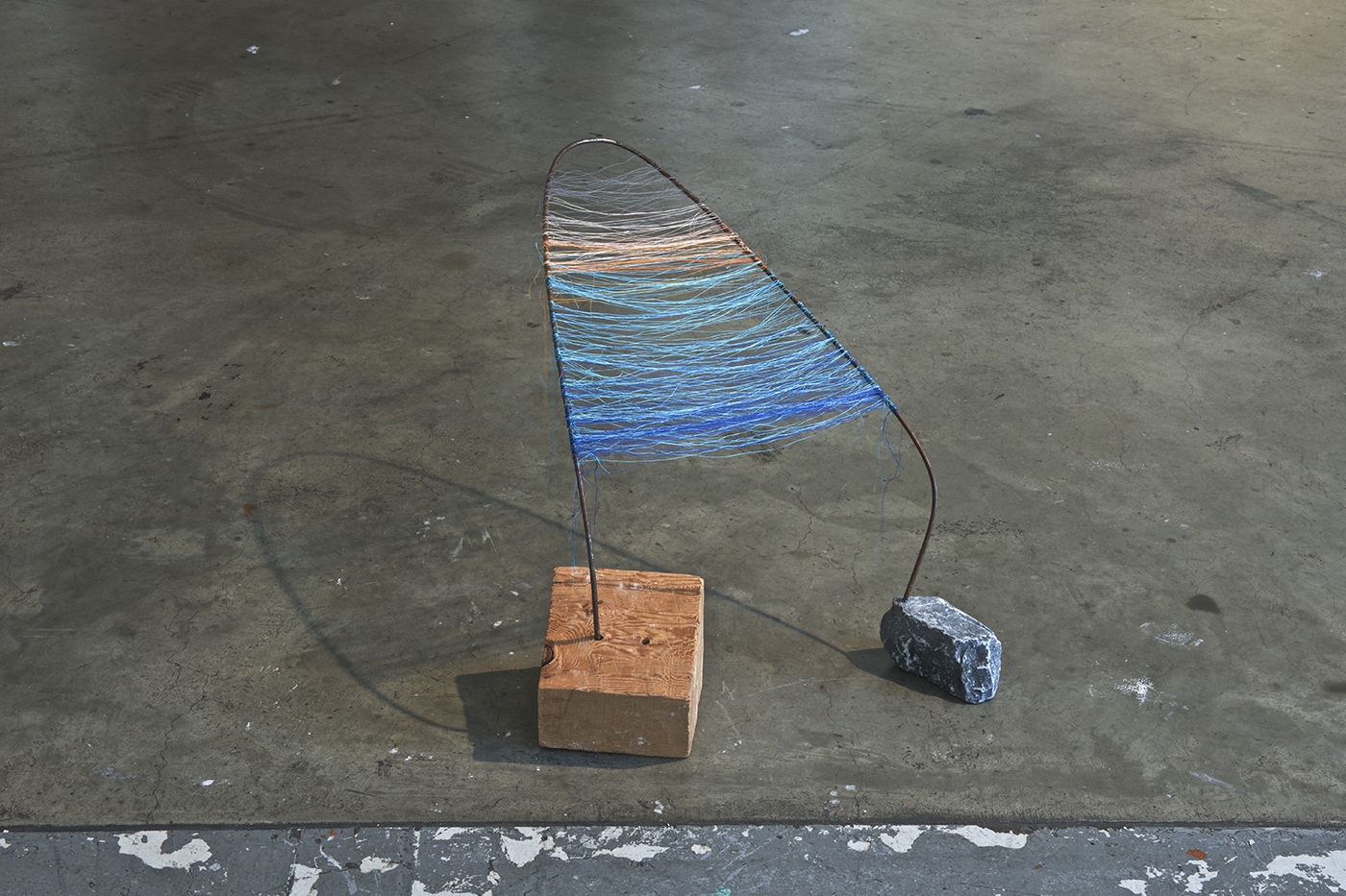 Sunset on Copper Moon Lake - Wood, rock, steel rod, thread - 2015 (collaboration with Lauren Lavery)