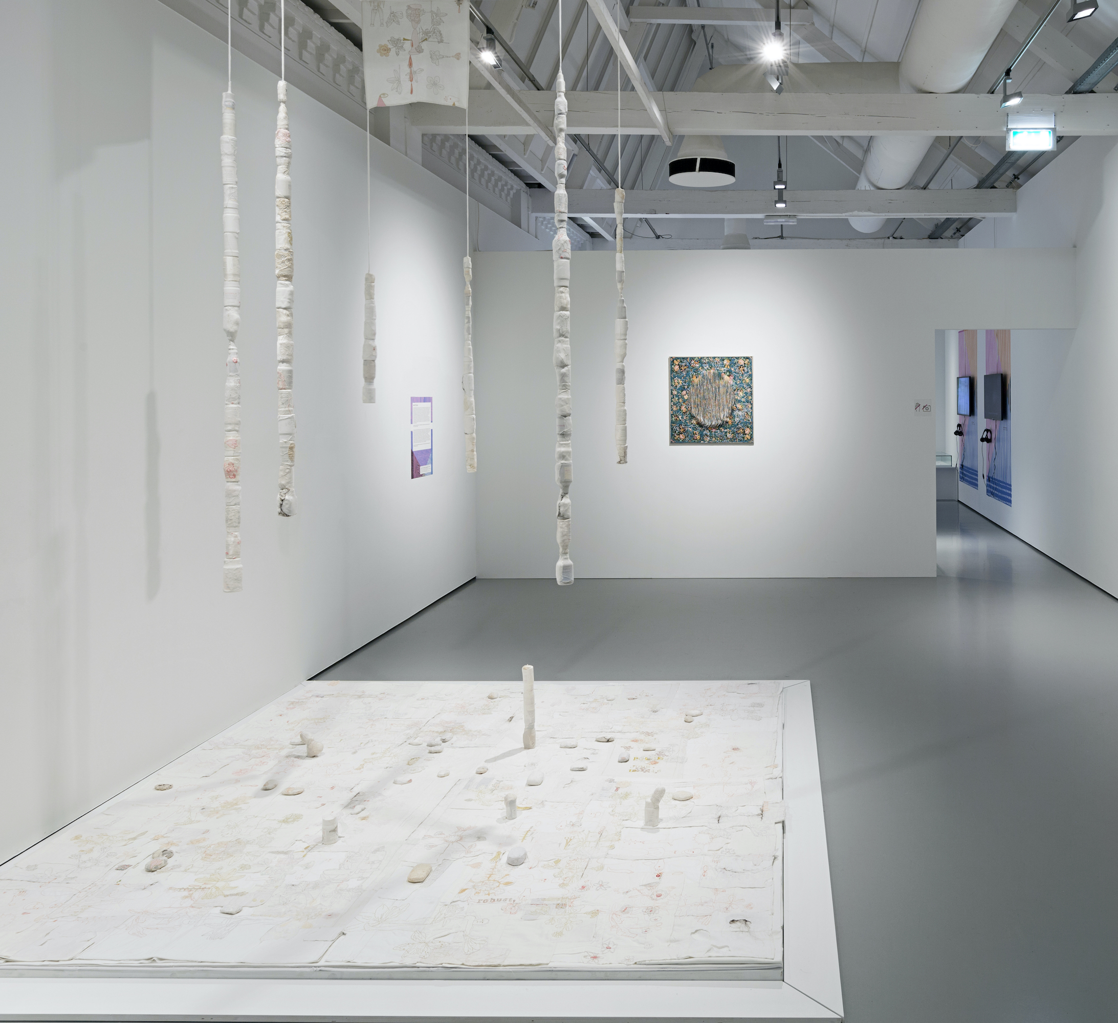  Memory Unsettled, 2016 (Installation view), Embroidery on various fragments on second-hand and old fabric, hair, medicine bottles and soap . Sizes and dimensions variable . Cultural Threads, 2018 . Textile Museum Tilburg . Collection Textile Museum Tilburg, The Netherlands