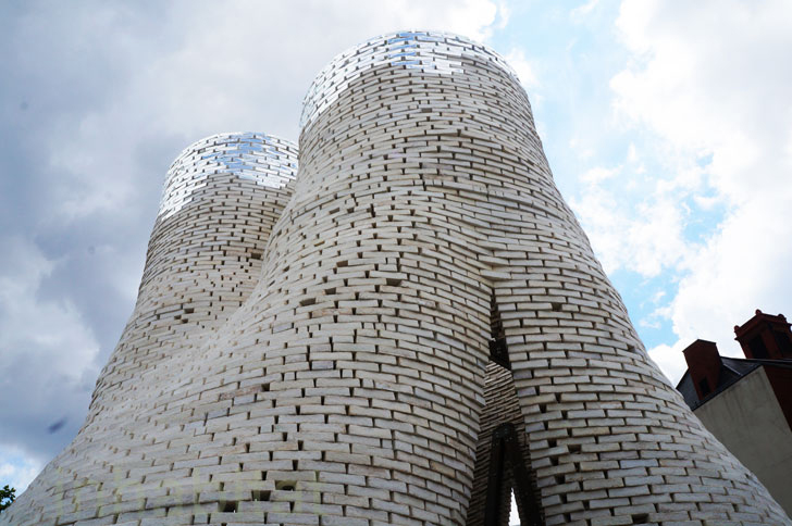 David Benjamin and his design firm, The Living, used bio-bricks made from corn waste and mycelium (mushroom roots) to create The Hy-Fi Tower at MOMA PS1. It is the worlds first mushroom building!