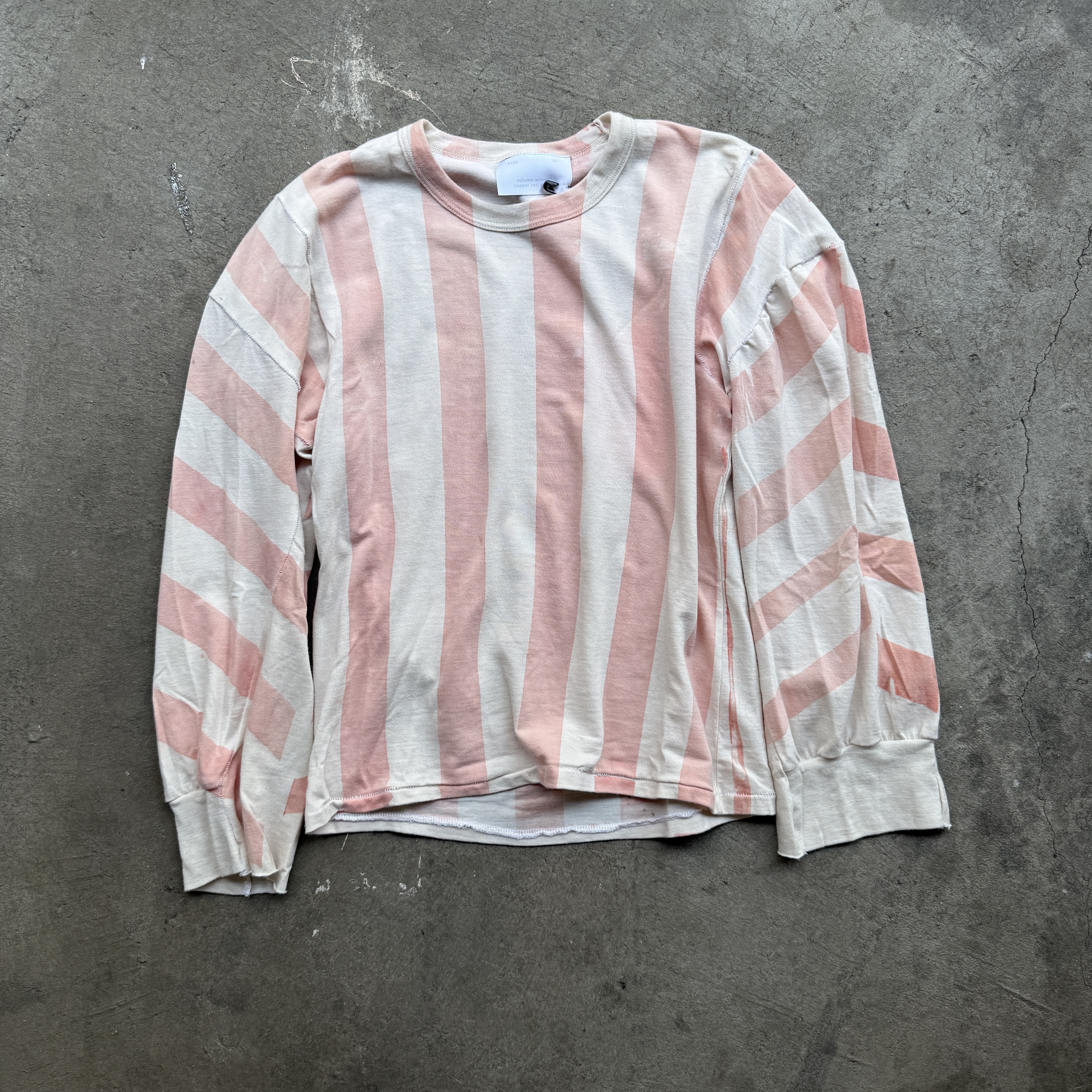 Reclaimed vintage surplus thermal shirt tailored to have boxy fit and wide sleeves. Allover printed with stripes using thermochromic ink, which changes color when exposed to heat.