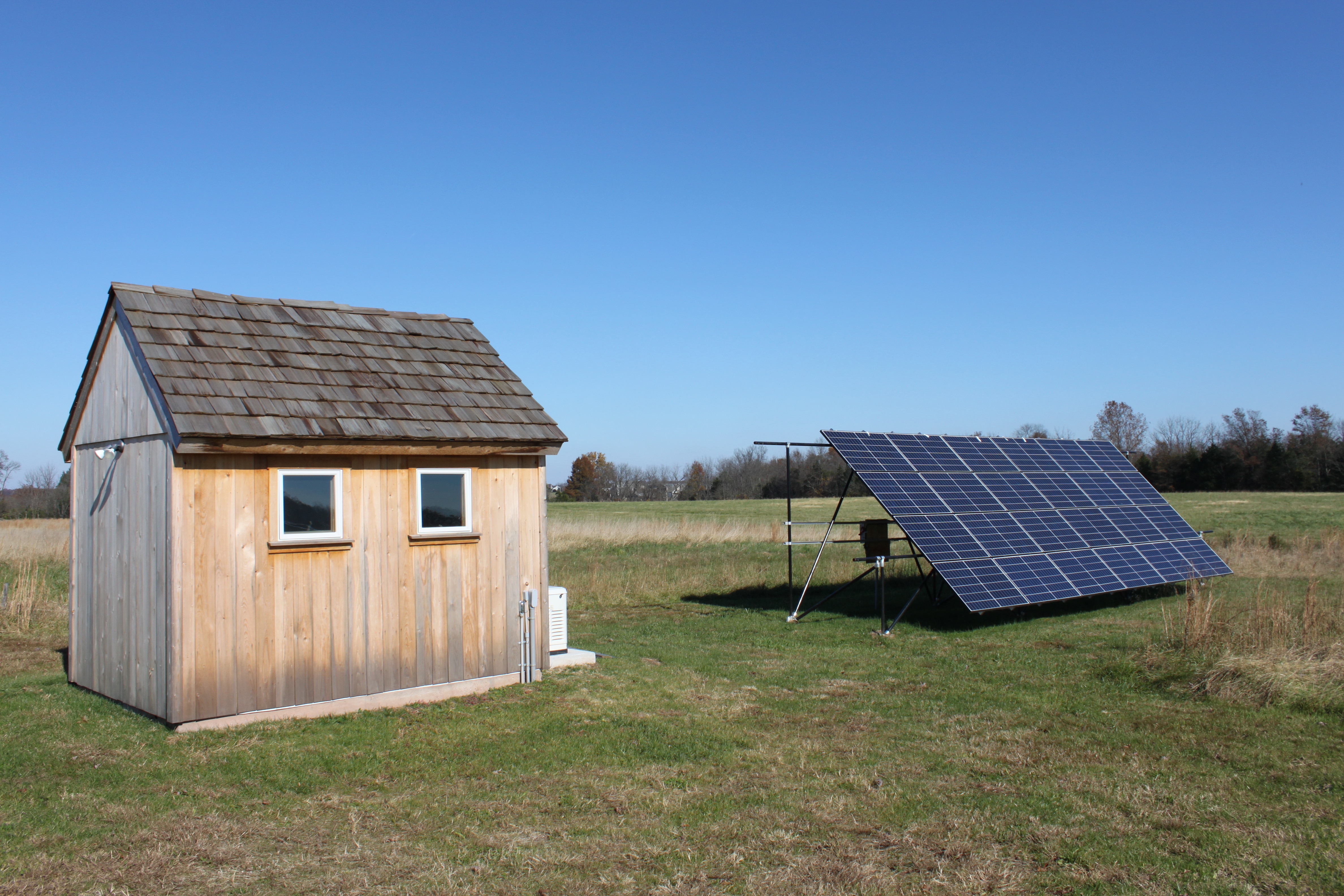 An 8 kW solar system with batteries provide 100% of the home's energy needs. The home is not connected to the grid for power, water or sewer. Batteries can power the home for over a week in the winter with no solar input. A small backup generator was required by the County. 