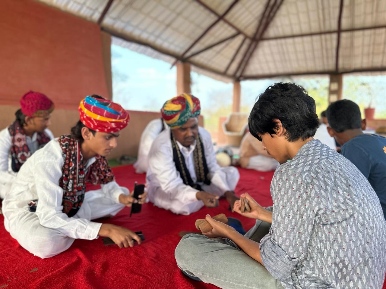 Musicians interacting with school students.