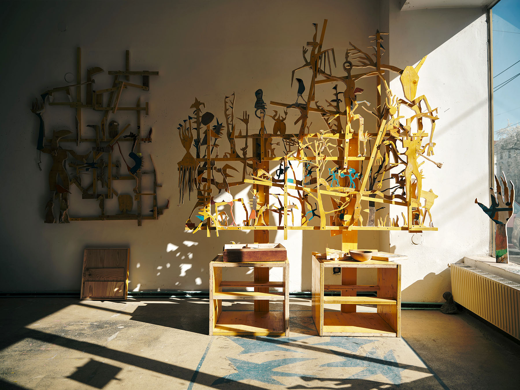 contemporary artist and his studio wit wood sculpture and artworks