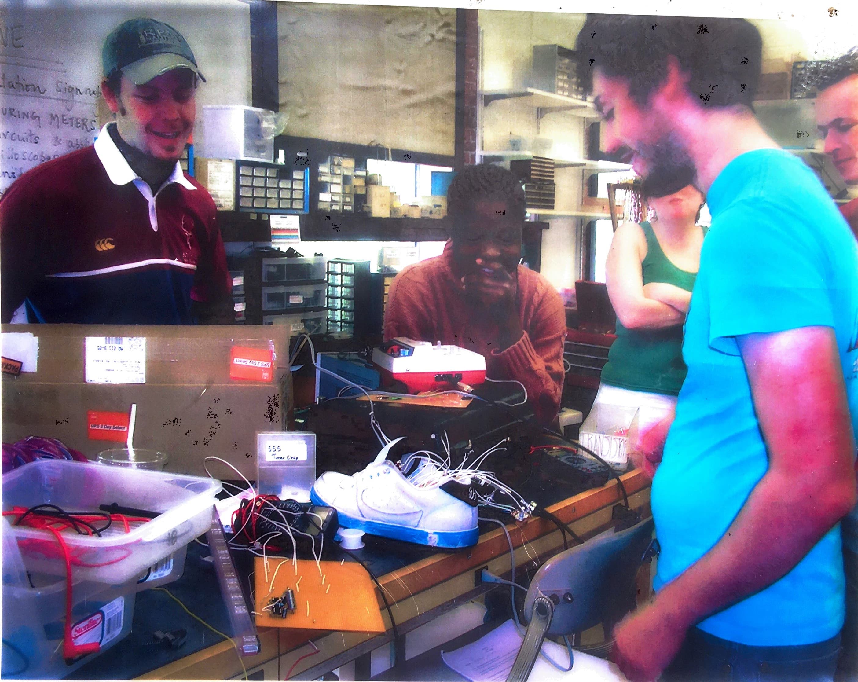 Showing off my "shoe synthesizer" to electronics class at Smith College, 2006