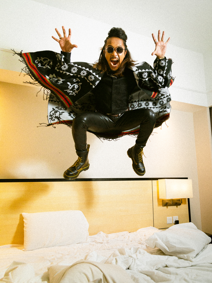 Hazama in his hotel room