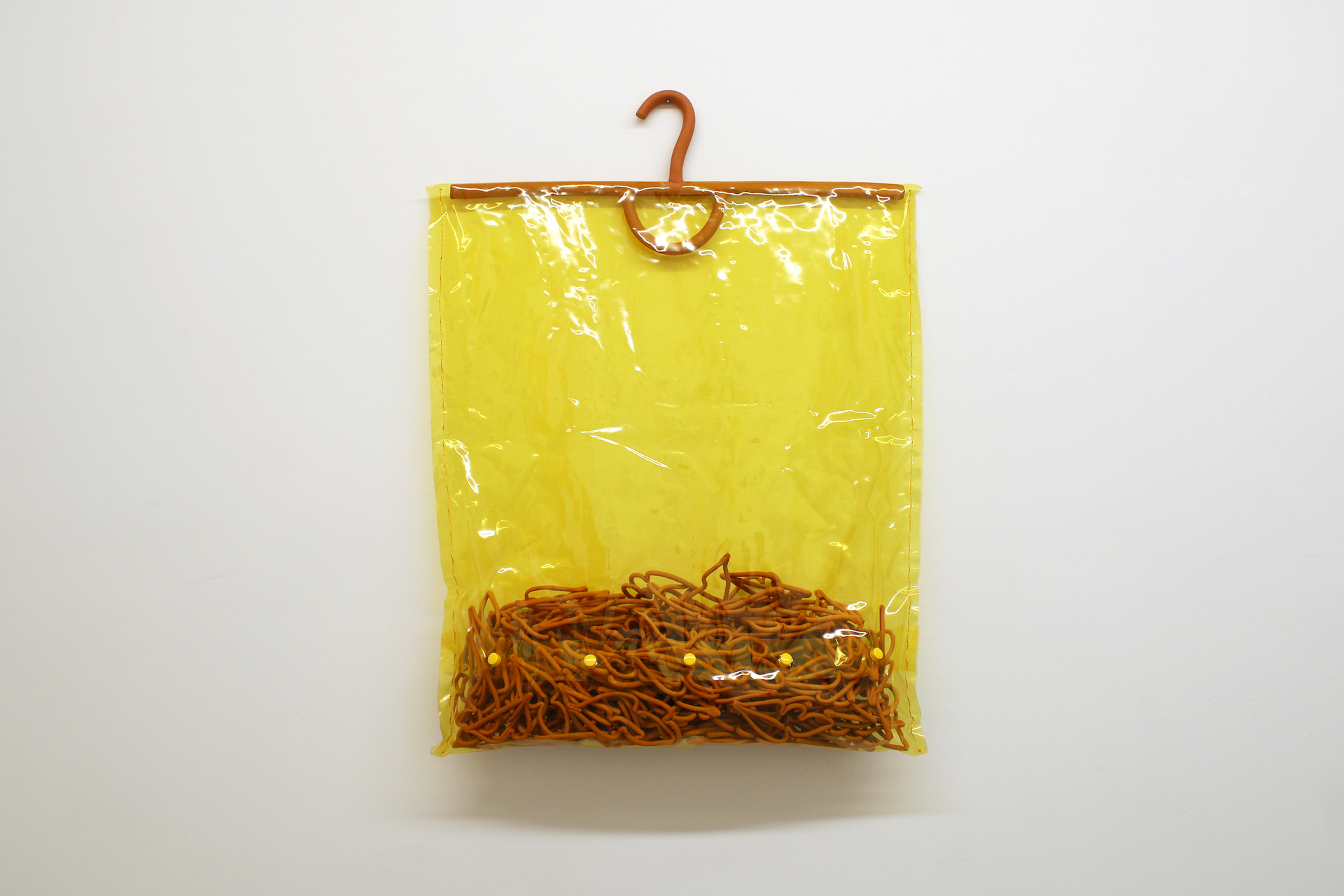 Peg Bag, 2021, vinyl, ceramic terra-cotta, plastic snaps, 29" x 21" x 3"
