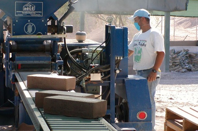 AECT 3500 hydraulic block machine - built in Texas - can produce 480 earth blocks an hour.