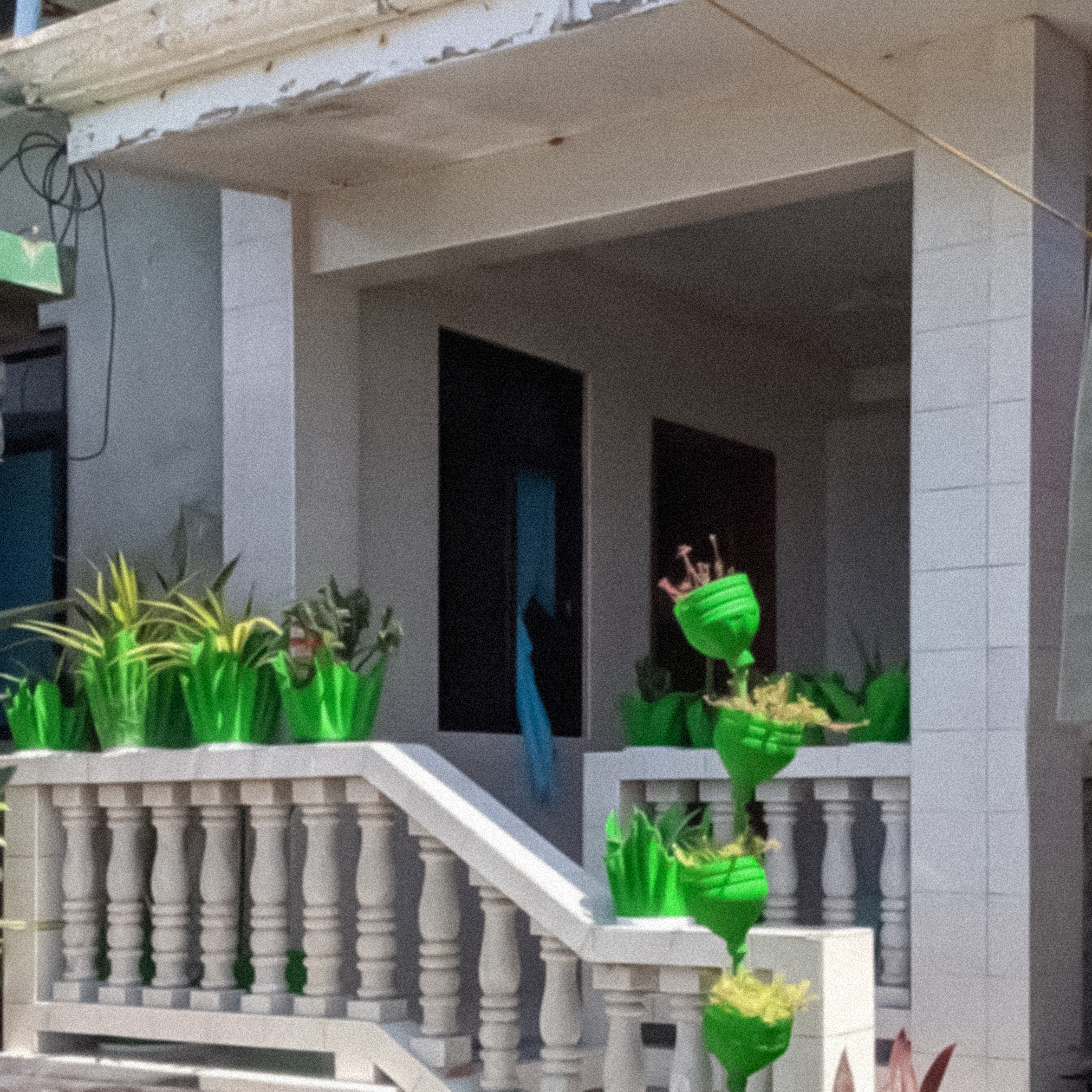 Concrete planters molded after fabric and plastic bottles⚲ Batangas, Region IV-A © Zaxx Abraham