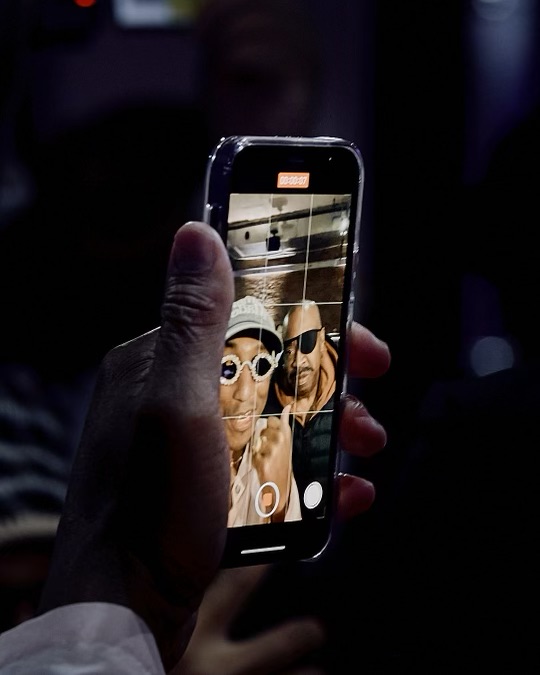 Pharrell and Slick Rick the Ruler taking Iphone selfie