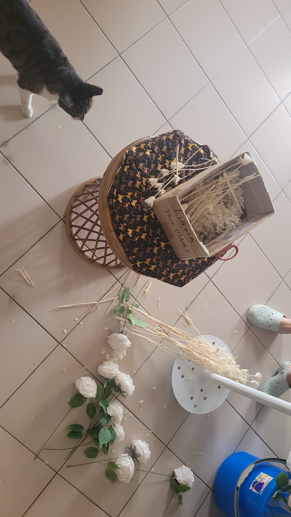 Prepping the preserved and artificial flowers for the installation.