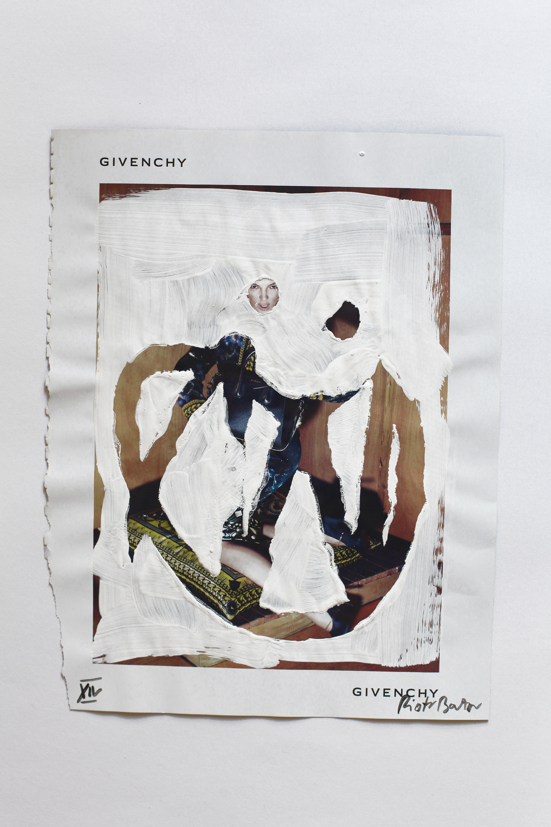 "No. 14" from "making faces" series. Approx. 28.5 x 22 cm / 11.2 x 8.6 inches. White household paint on magazine page